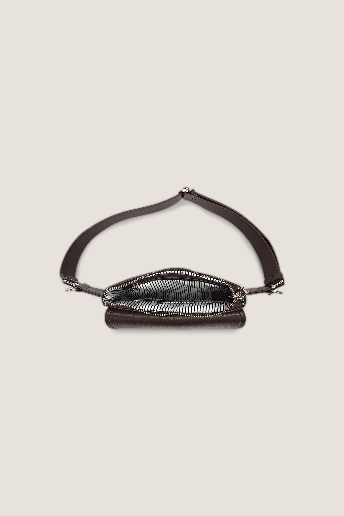 The Lola Chocolate Belt Bag unzipped from above, showing the striped lining.