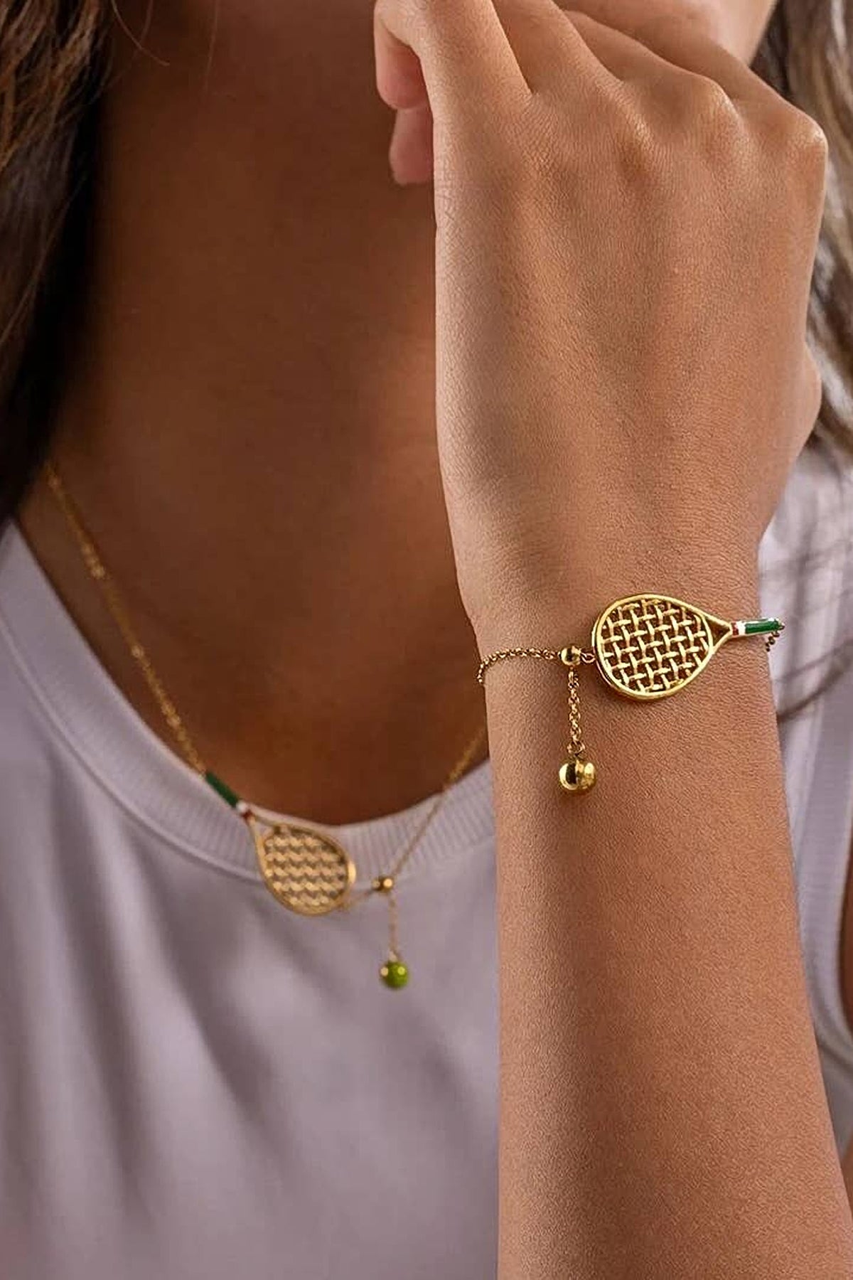 The Country Club tennis bracelet worn with the matching racket necklace.