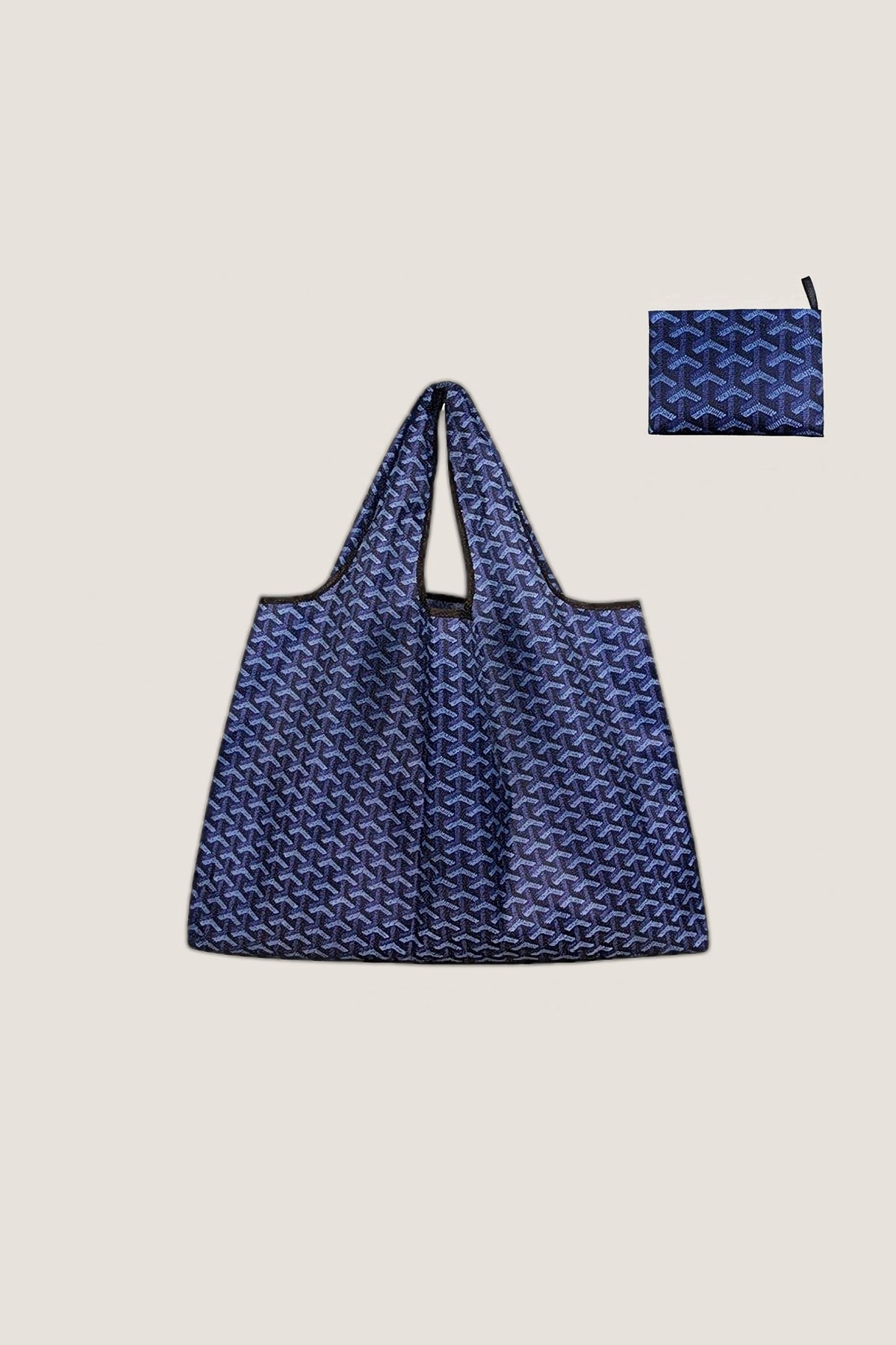 The navy Eco-Friendly Pocket Tote, open, with the small flat pouch it folds into.