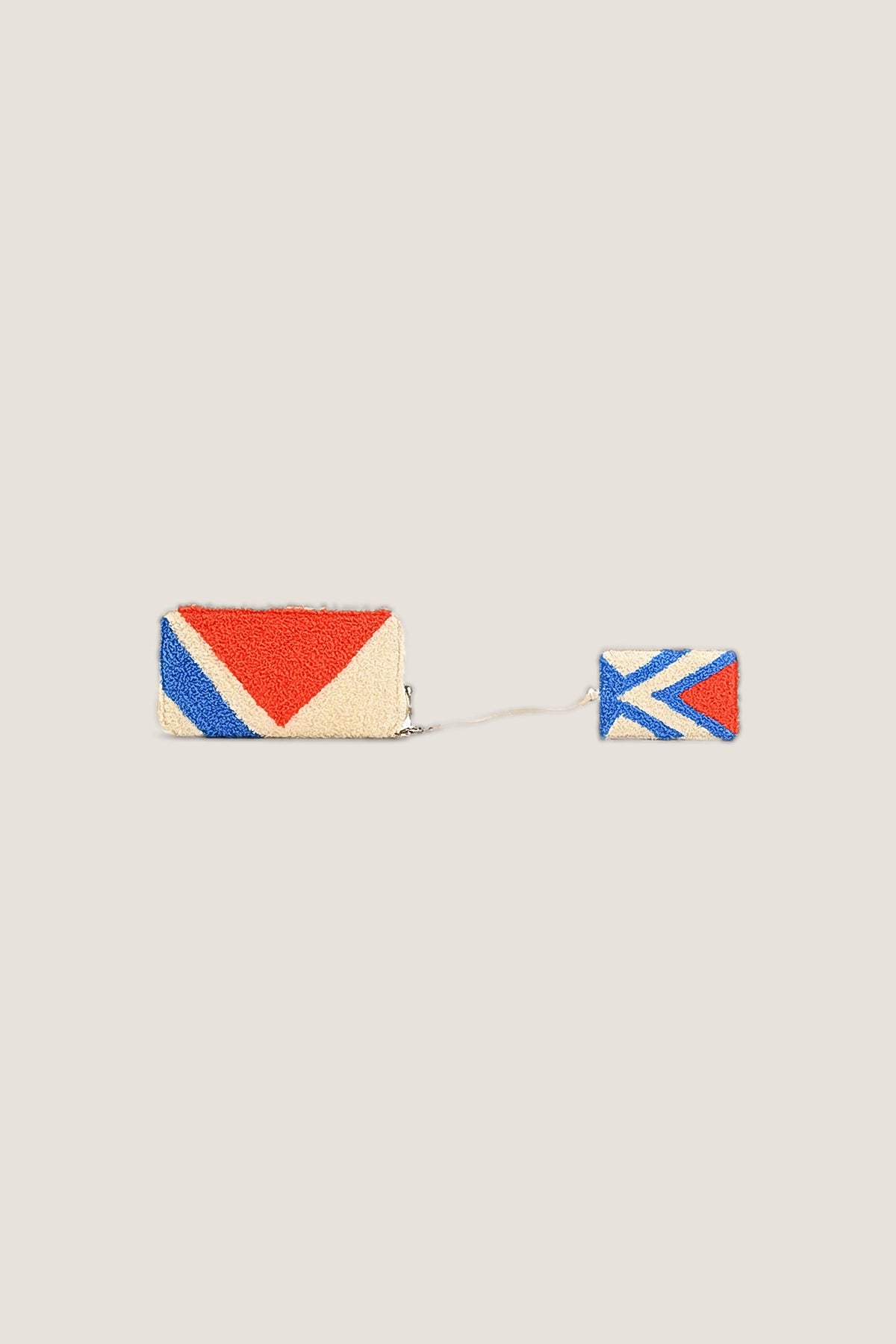 The Embellished Wallet in cream chenille with a red triangle and blue stripe, shown with its matching removable card holder on a cord.
