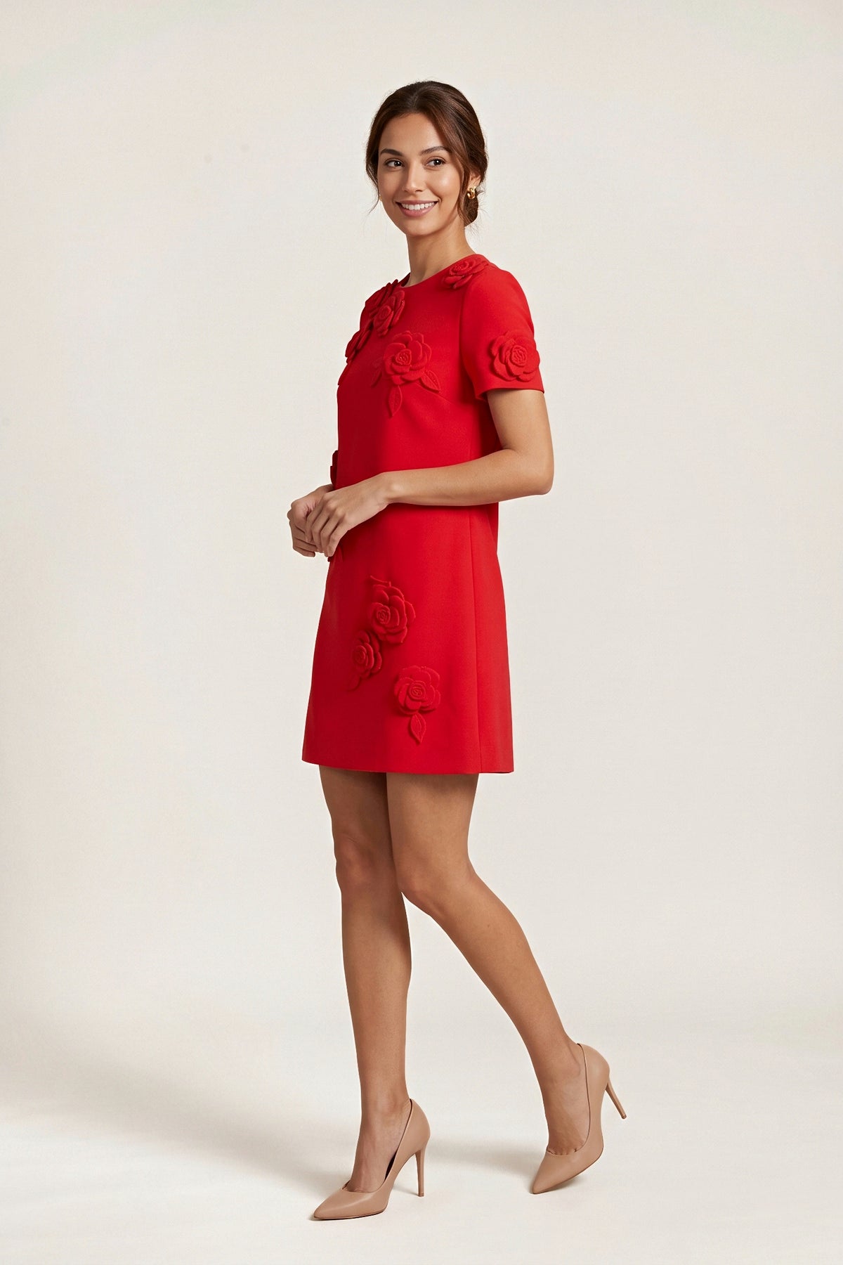 Three-quarter view of the red rose applique shift dress, showing the crew neckline and the roses on the sleeve and skirt.