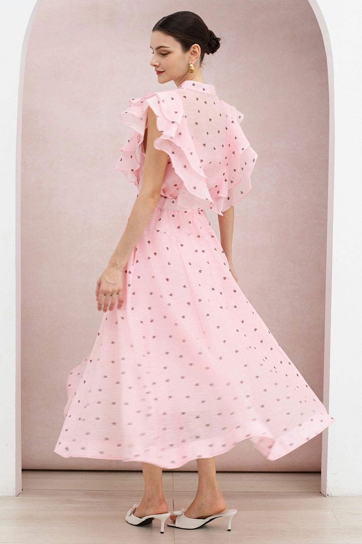 Back three-quarter view of the heart print organza set showing the tiered shoulder ruffles.