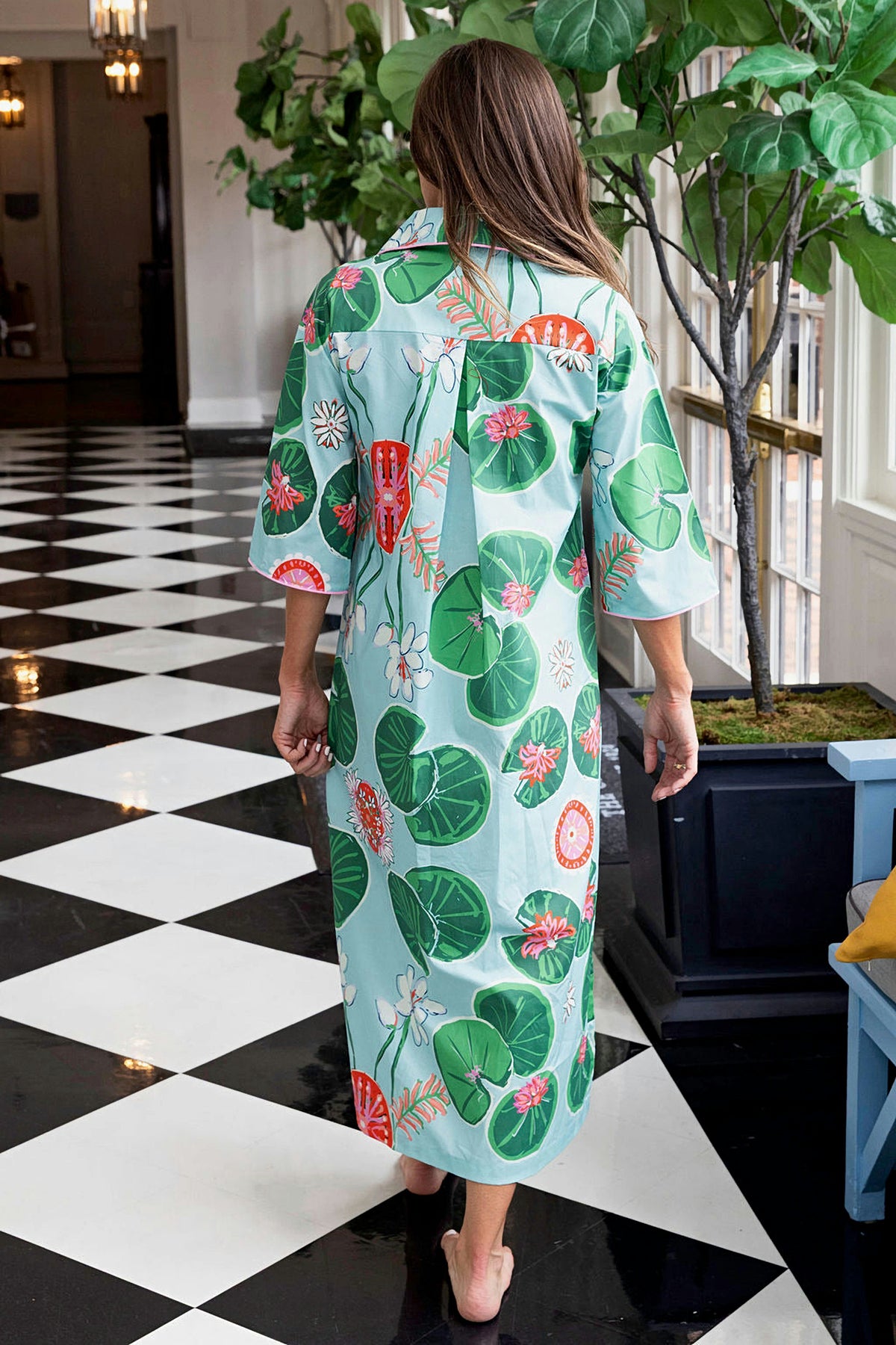 Back view of the Lolli Cassidy long dress in the green and aqua lily pad print.
