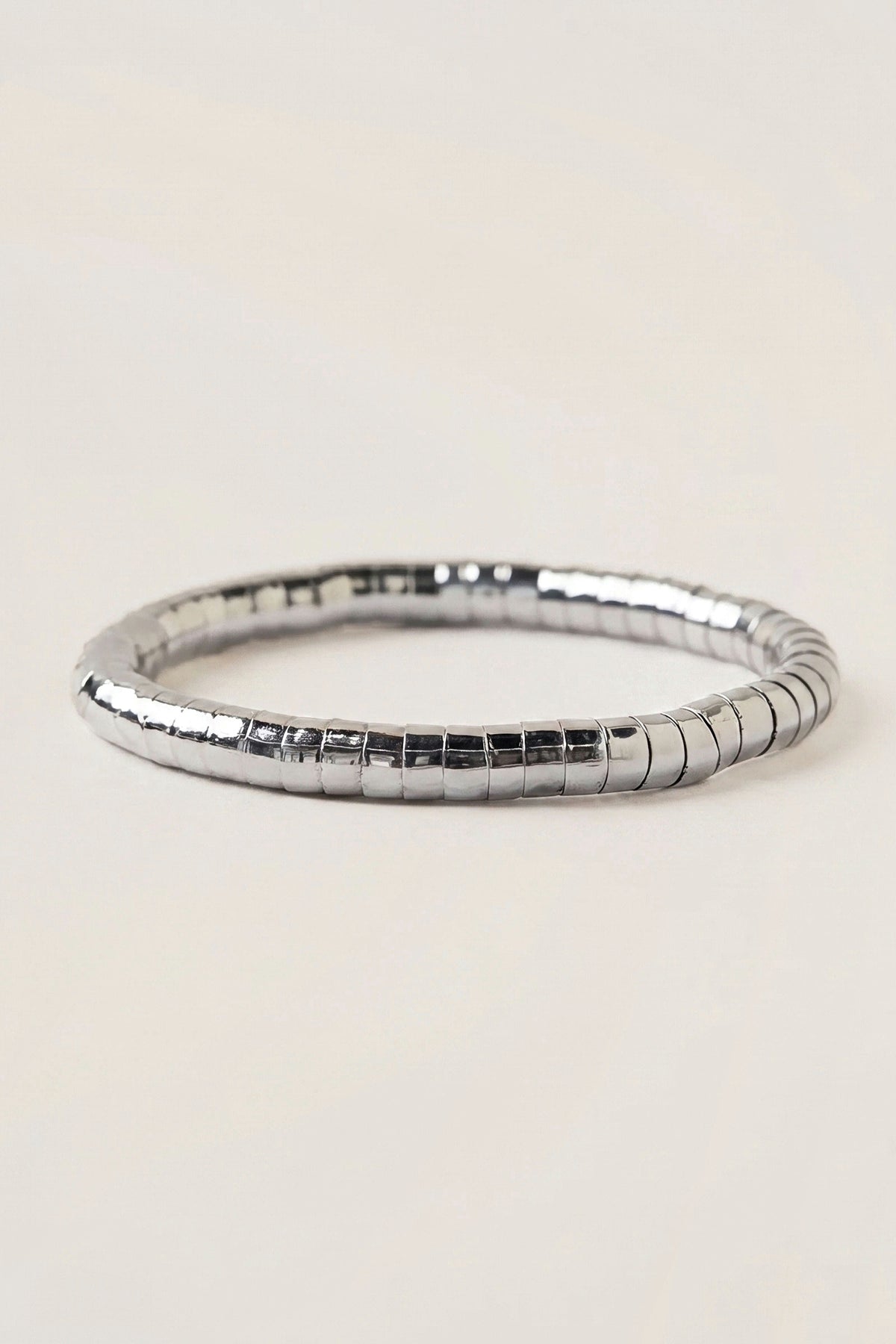 Side view of the Lucille Round Bead Stretch Bracelet, showing the round silver beads on the stretch band.