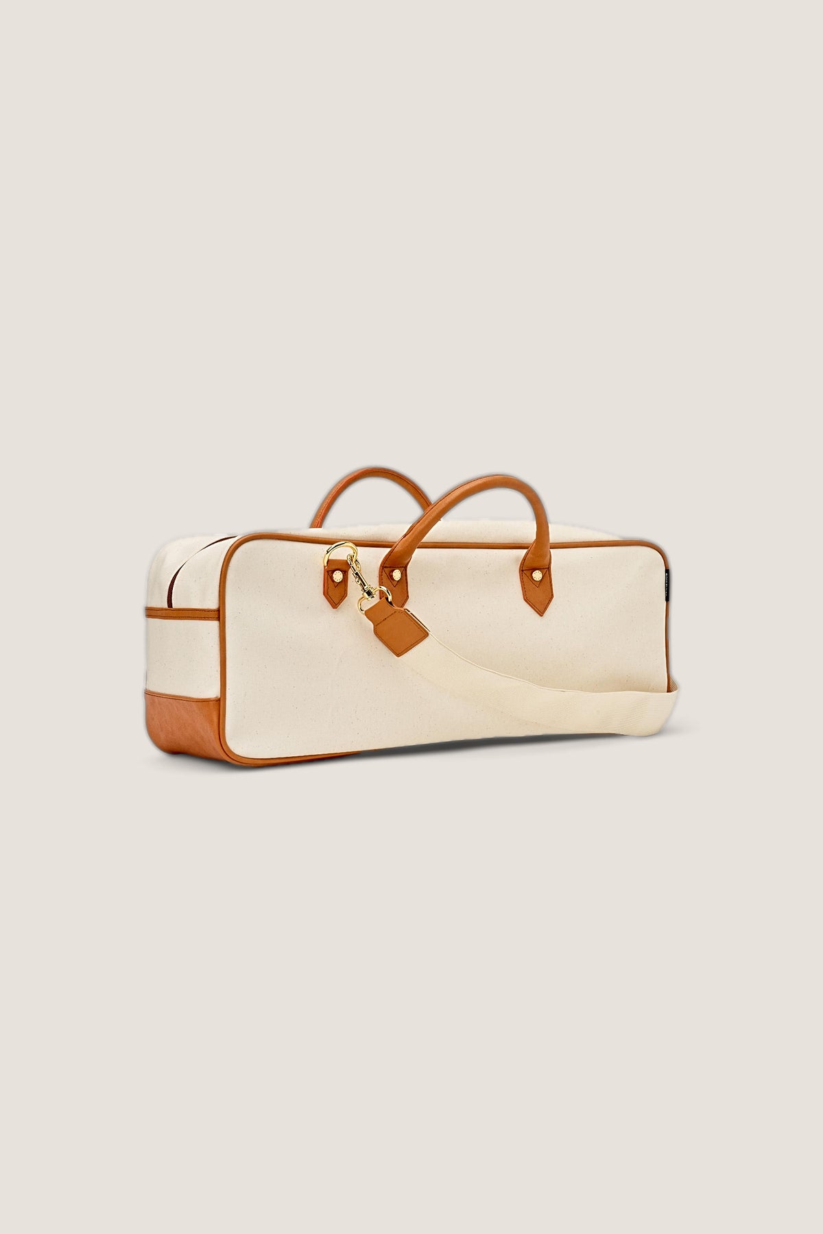 The Mint Margo mahjong tote with its removable canvas shoulder strap attached.