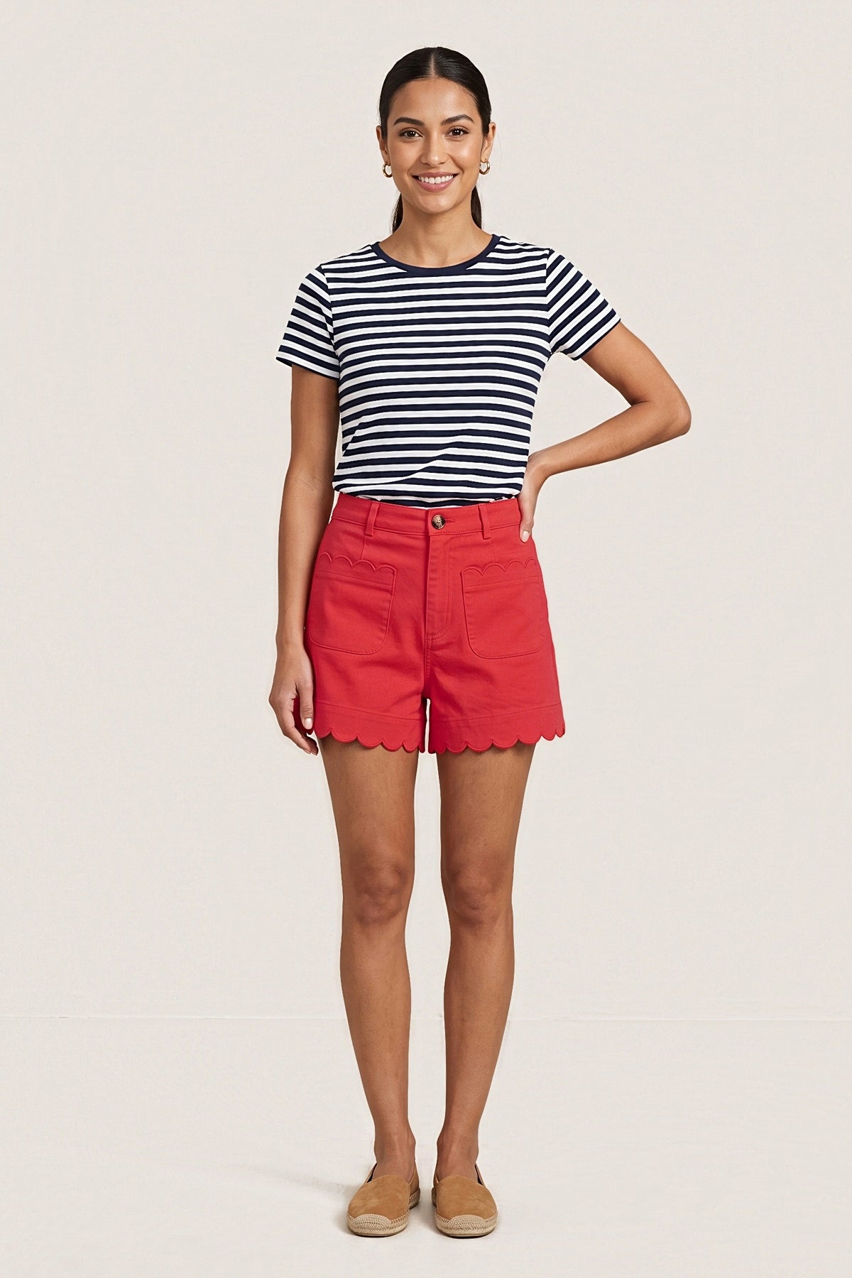 Front view of the Red Harbor high-rise shorts in bright red cotton twill with scalloped patch pockets and a scalloped hem.