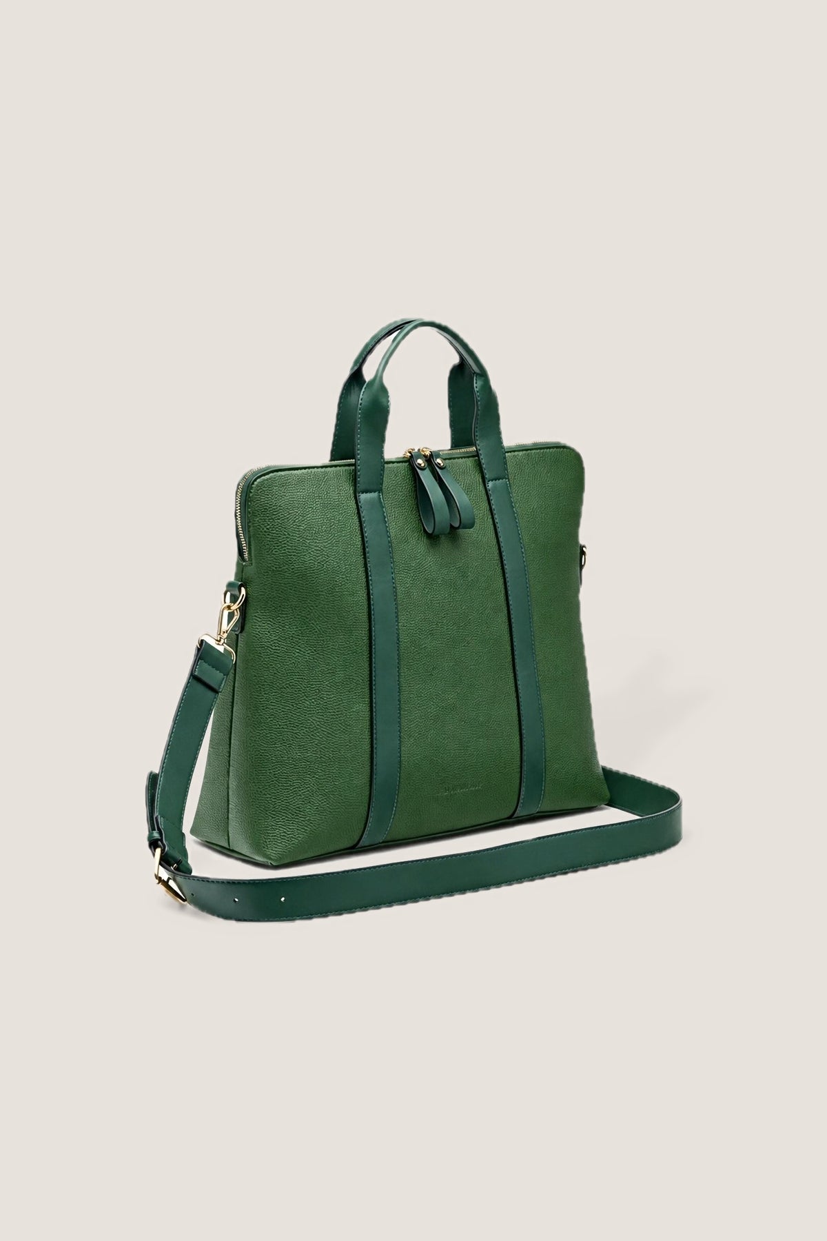 The green Rhodes Laptop Bag at a three-quarter angle, showing its depth and adjustable strap.
