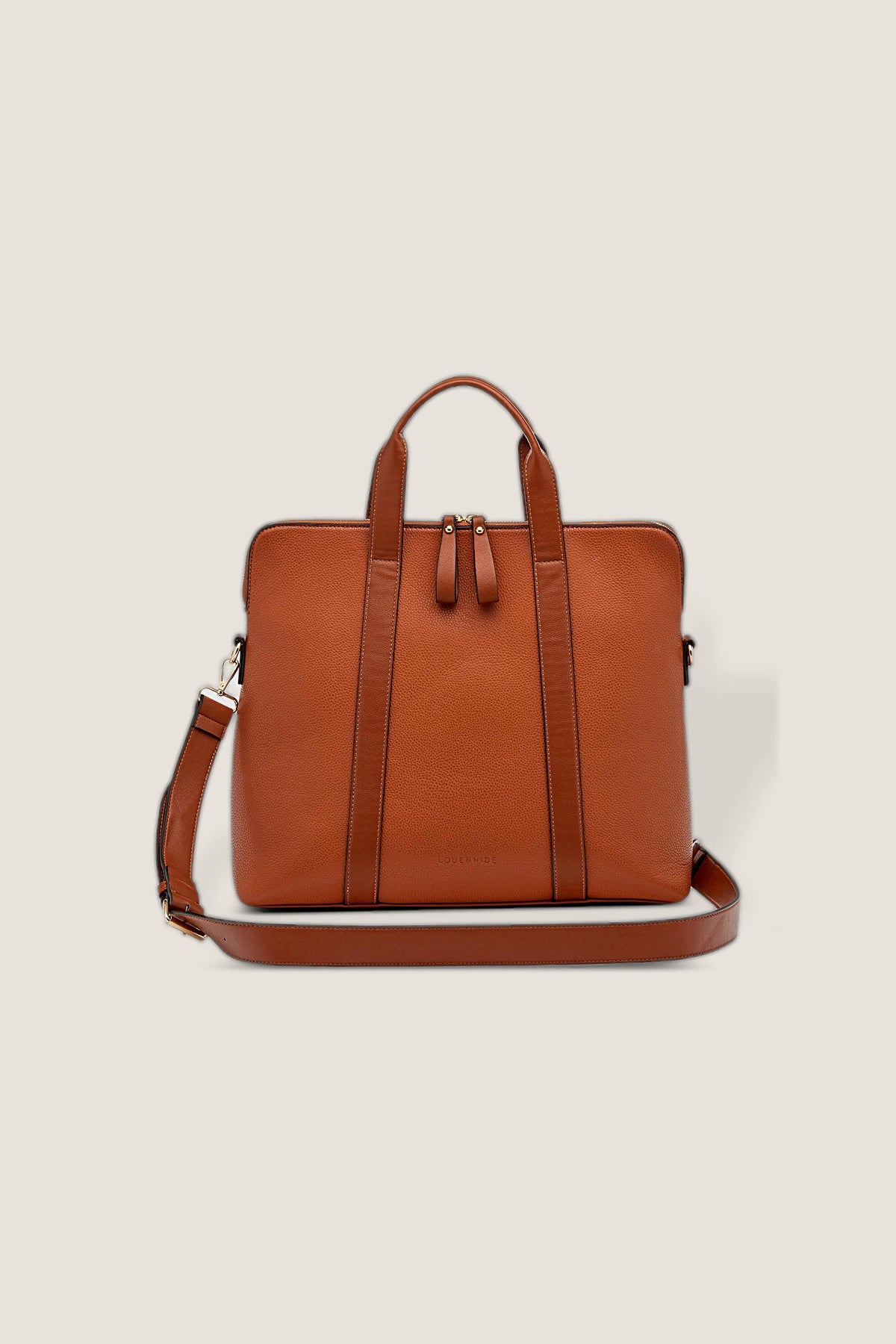 The tan Rhodes Laptop Bag from the front with its long strap draped in front.