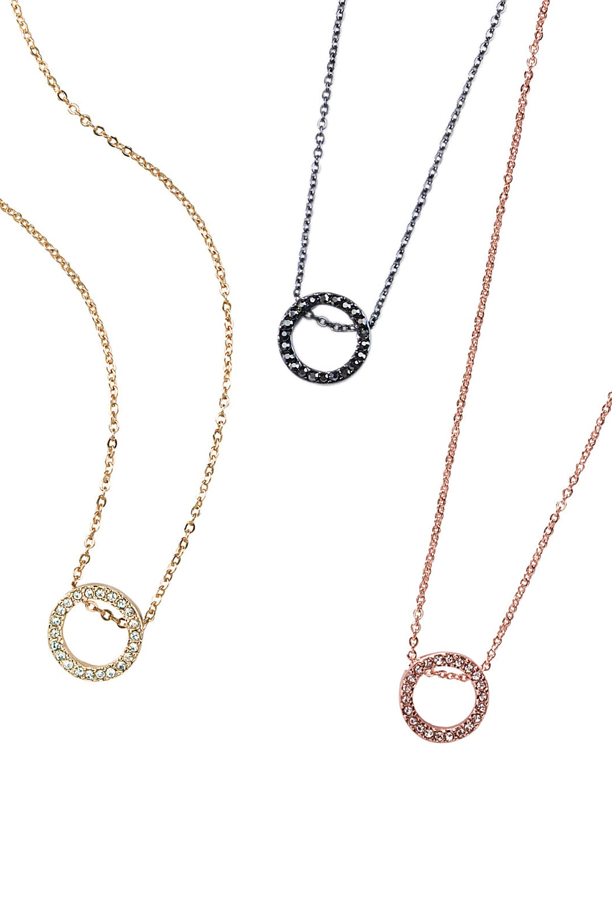 The Roo Necklace pave circle pendant in gold shown beside the hematite and rose gold versions.