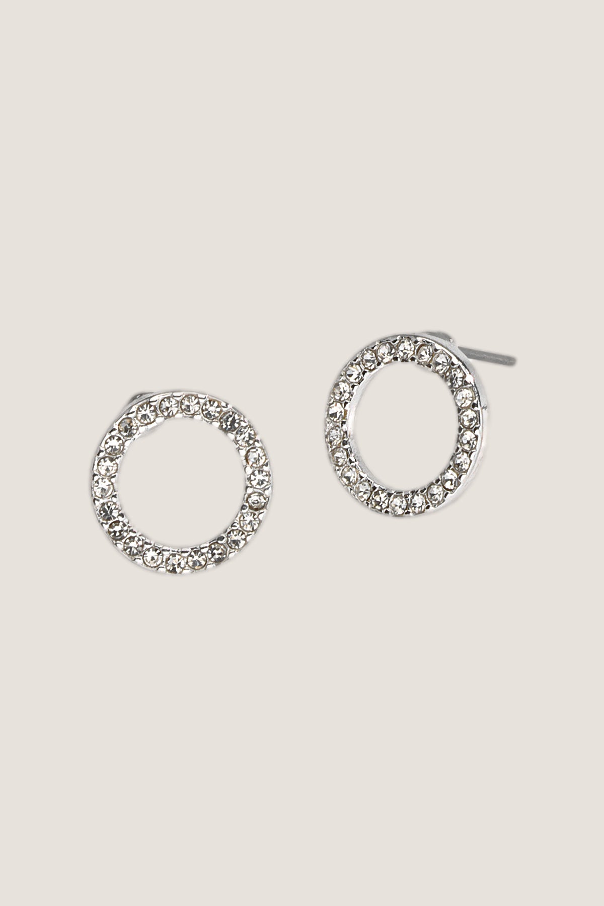 The silver Crystal Eternity stud earrings, open circles of clear crystals, one turned to show the post.