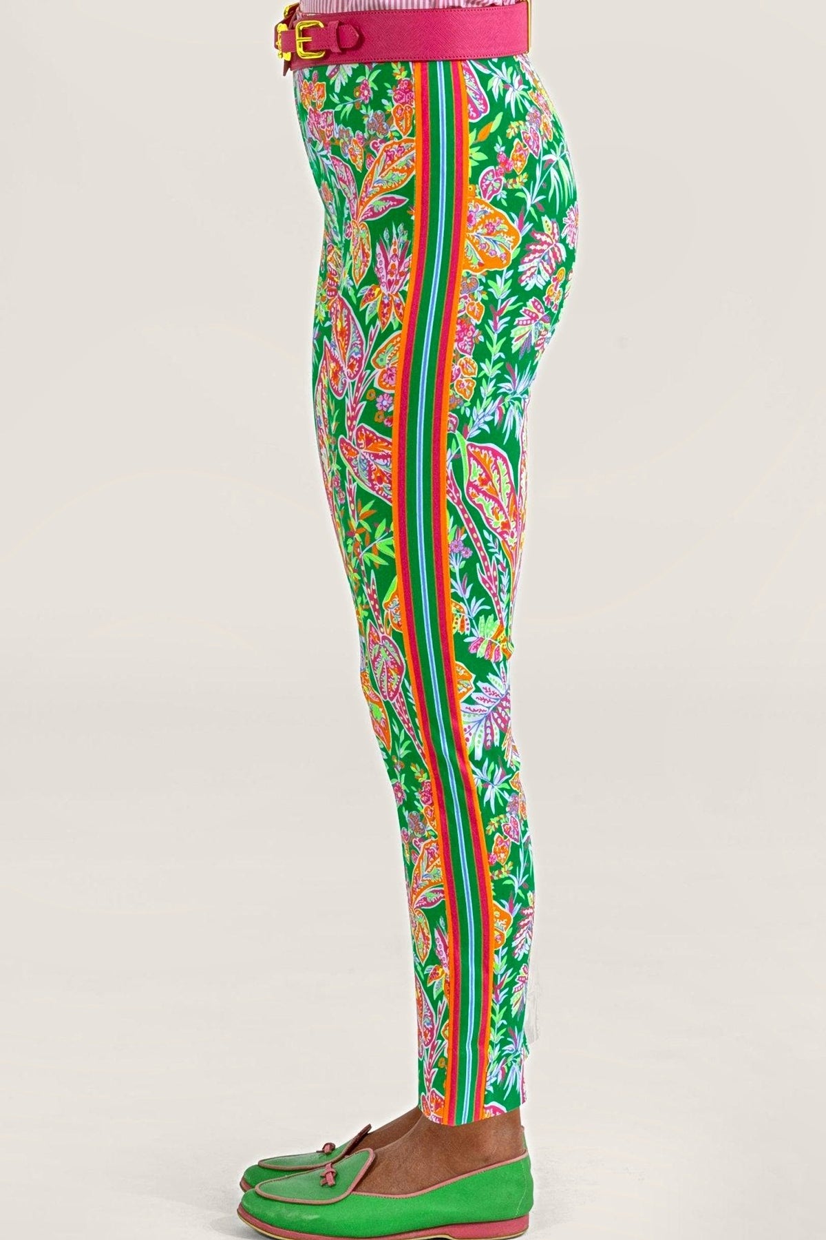 Side view of the kelly green vine print pull-on pants, showing the pink, orange and green side band.