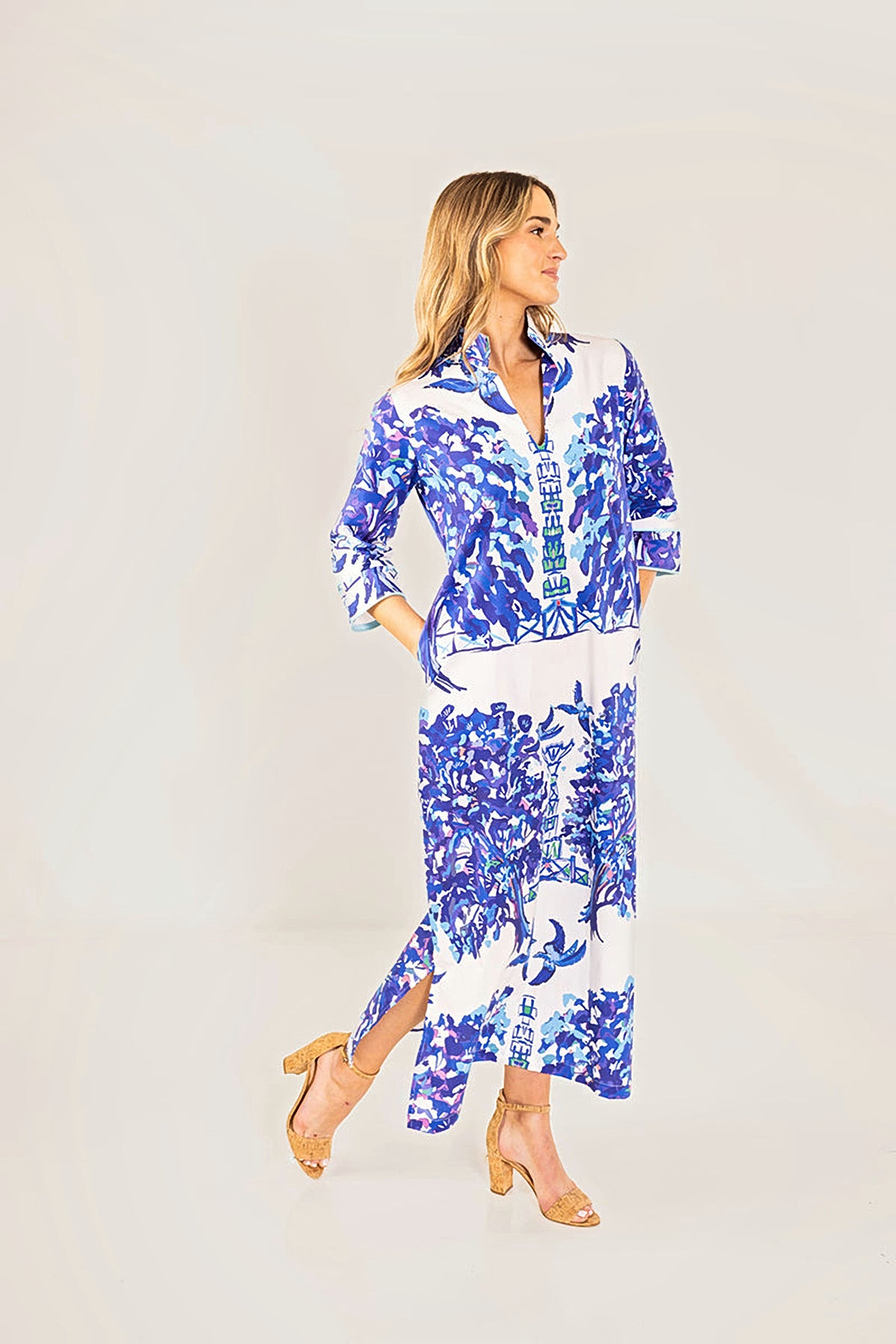 The Willow Bouvier long dress in motion, with the side slit opening as she walks.