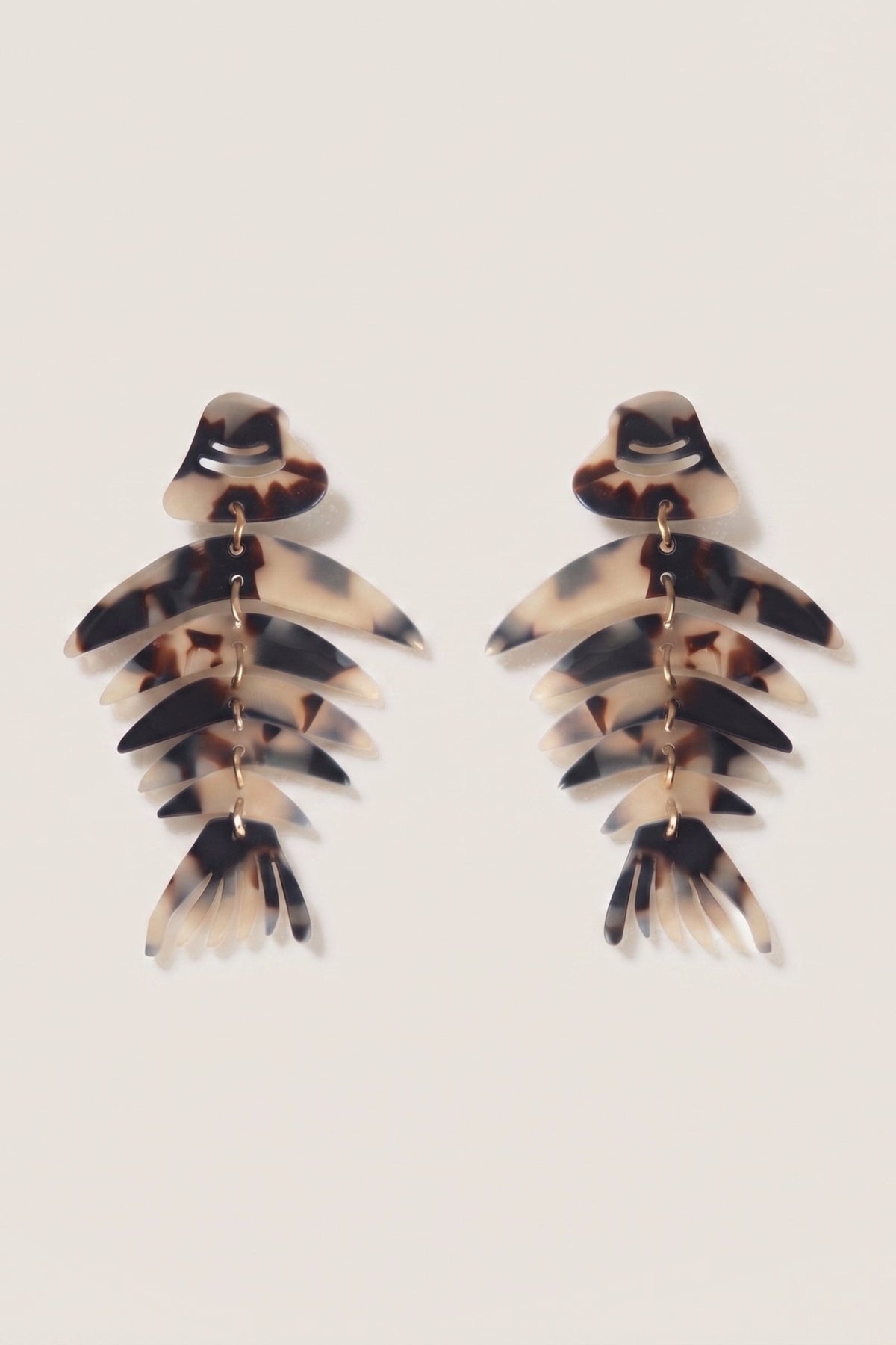 Bonefish Monstera Acrylic Drop Earrings on a cream background