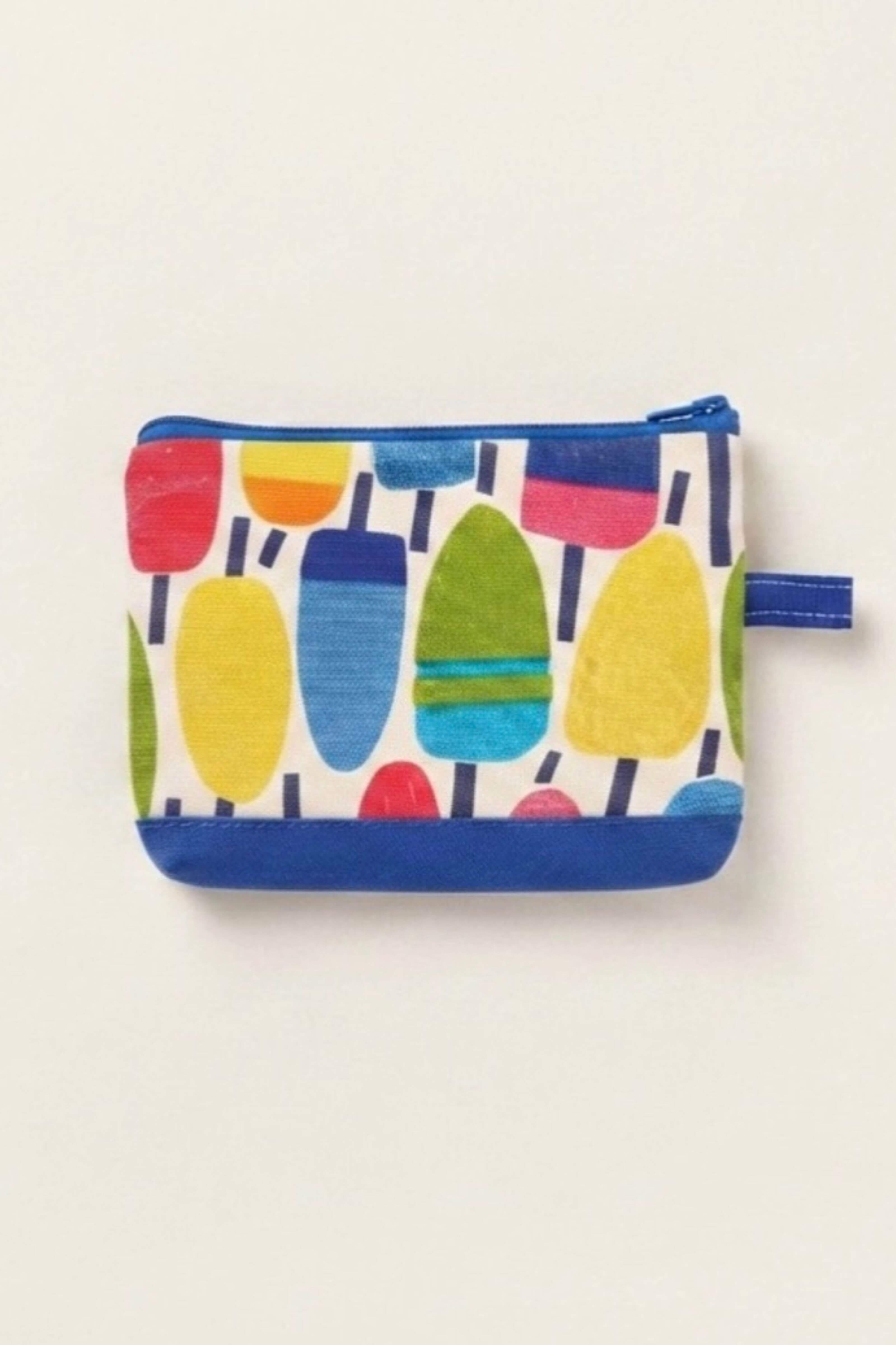 A small zippered pouch with a colorful popsicle print on a white background, featuring blue trim and a blue zipper pull, shown against a plain off-white background.
