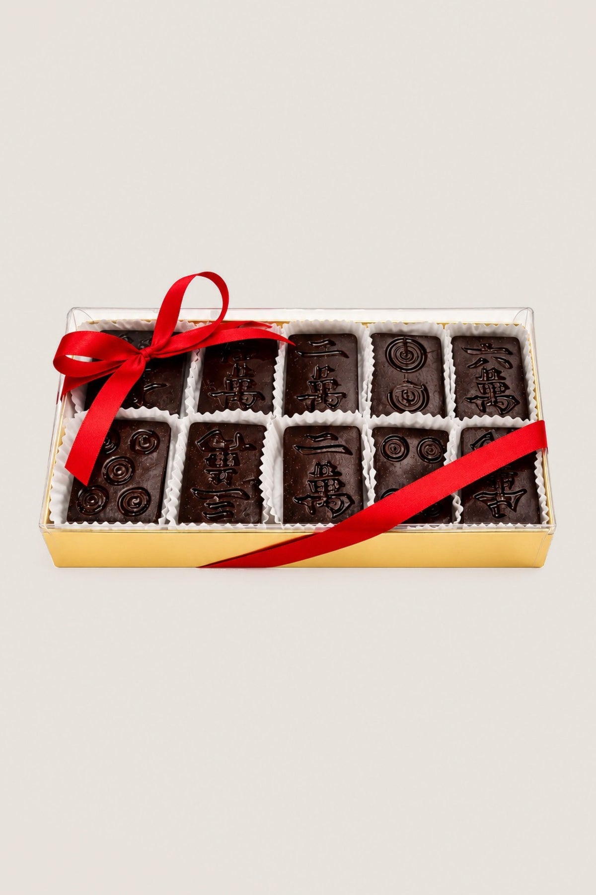 A box of chocolate mahjong tiles in dark chocolate
