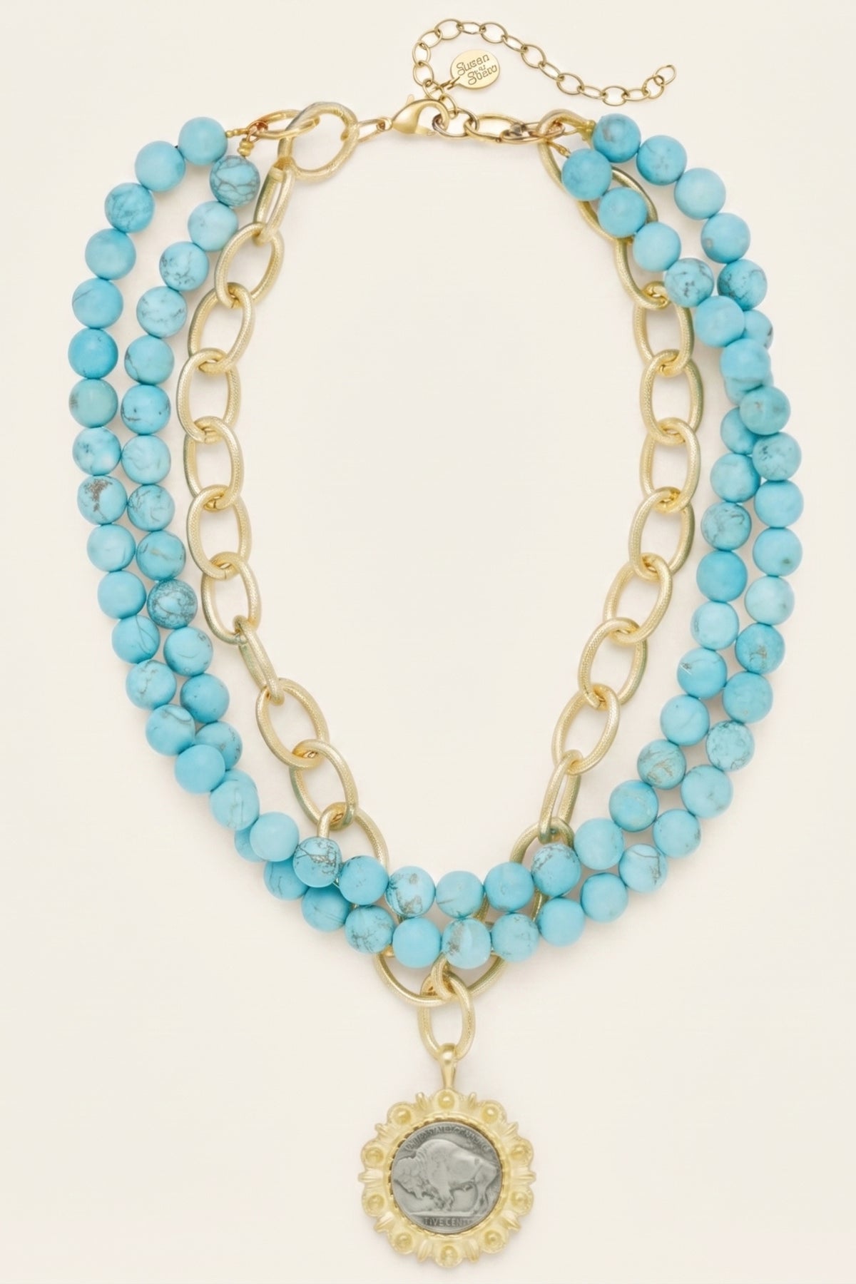 Gold and Buffalo Nickel on 3 Row Matte Turquoise Necklace on a cream background