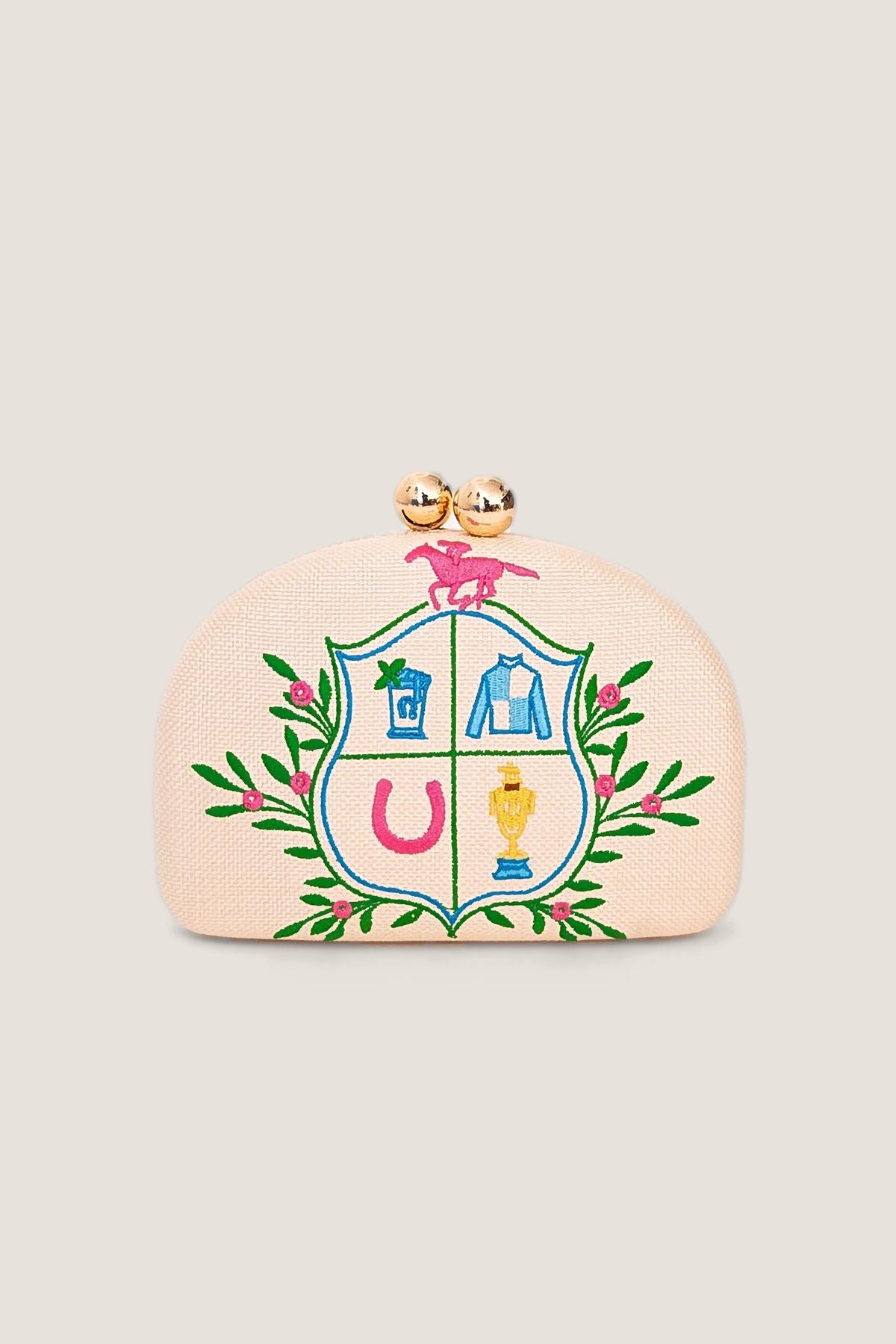 The Lisi Lerch Derby Embroidered Clutch in blush straw, embroidered with a racing crest of a horseshoe, trophy, jockey silks and a pink horse, shown front on.