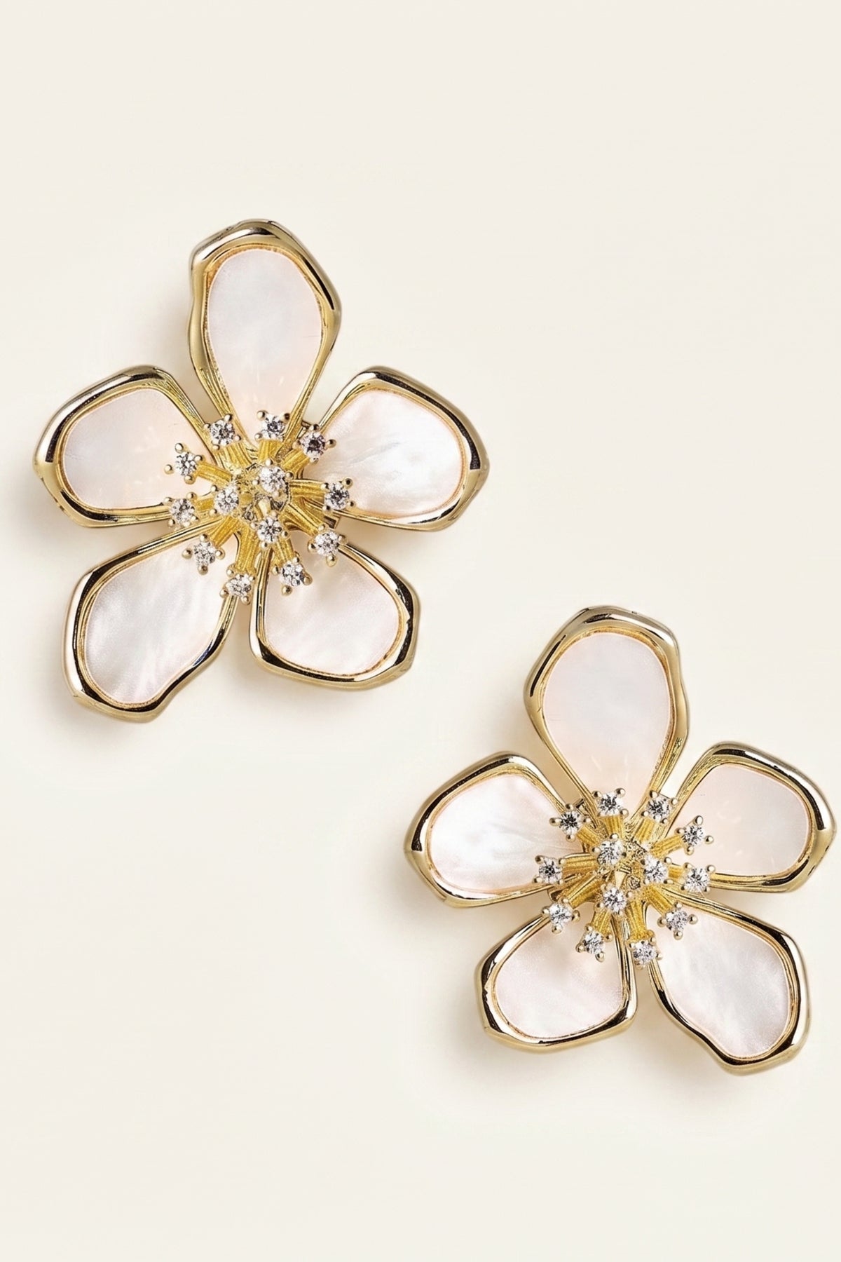Elinore Pedal Mother of Pearl Earrings on a cream background