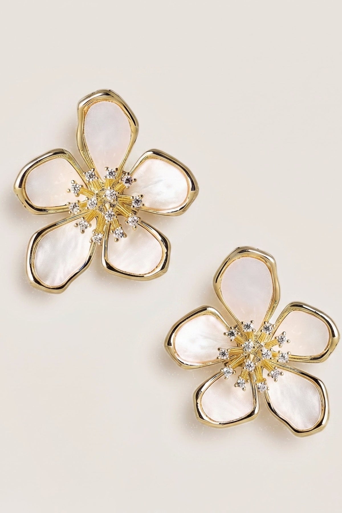 Elinore Pedal Mother of Pearl Earrings on a cream background