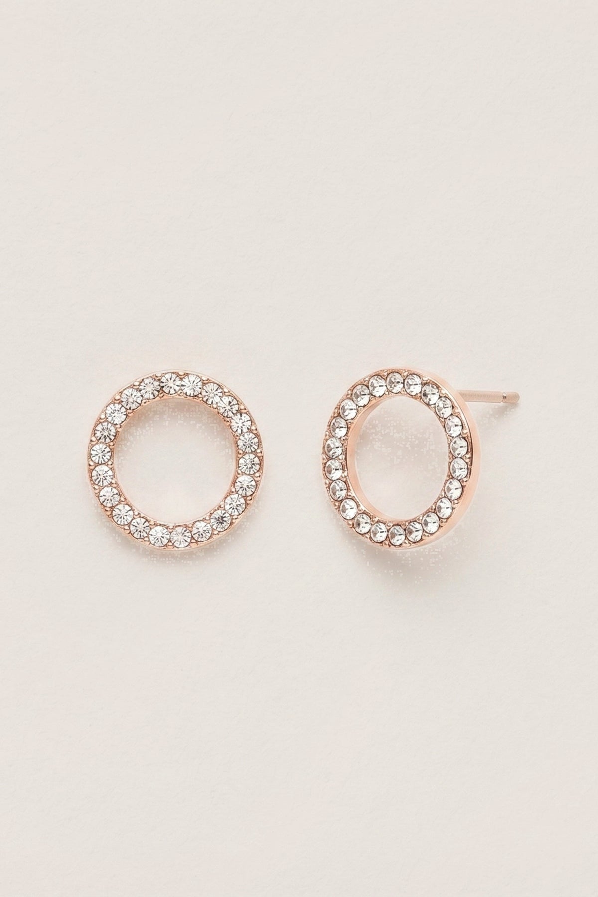 Gold Crystal Eternity Stud Earrings on a cream background