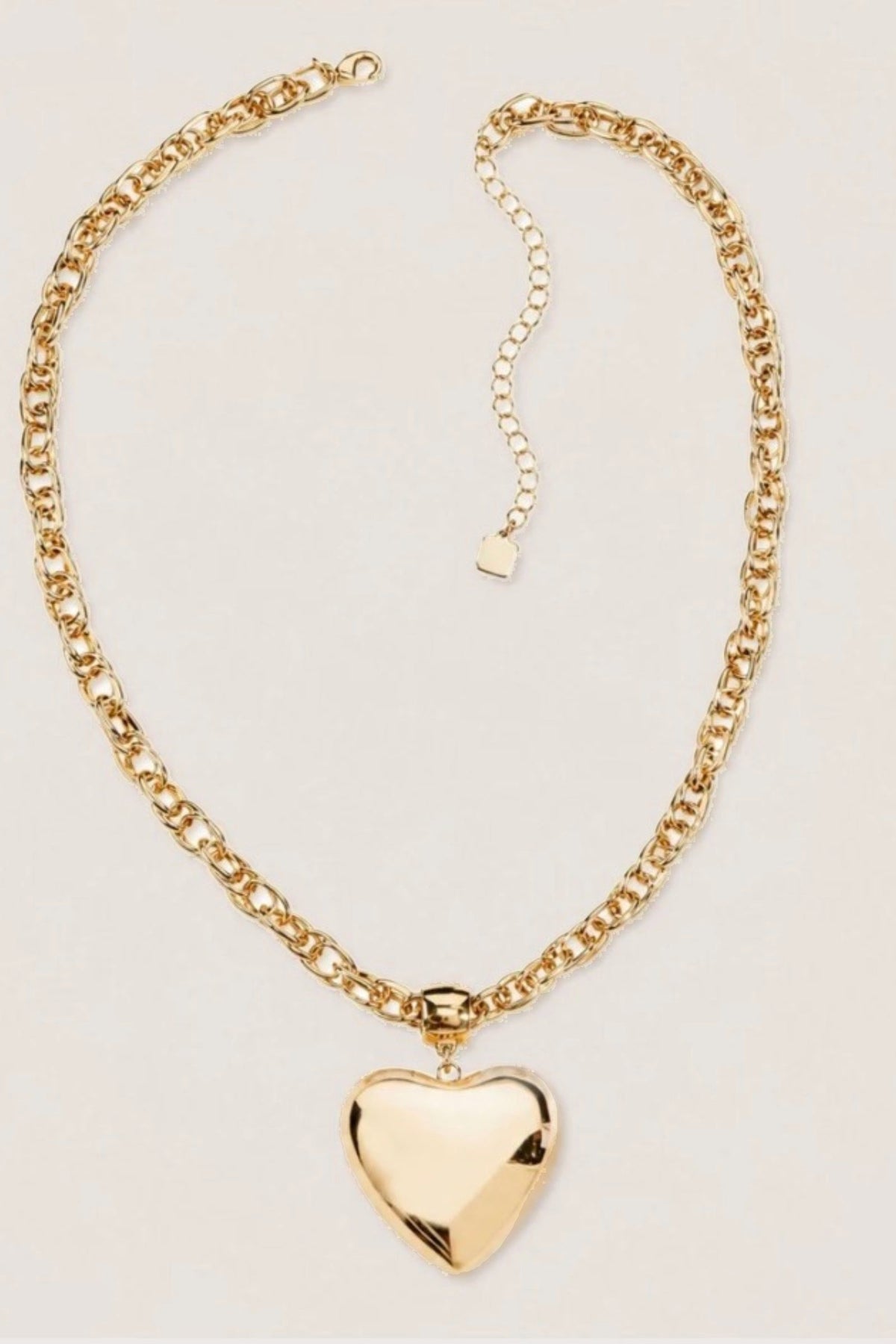 Golden Heart Chain Necklace on a cream background