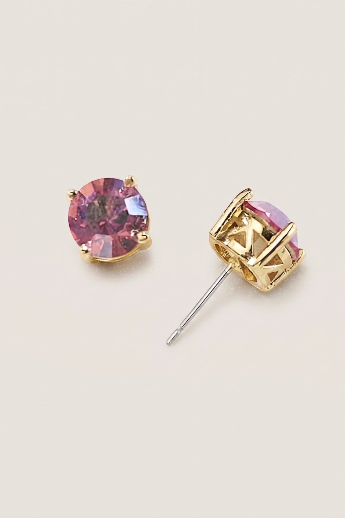 Iridescent Coral Sparkle Stud Earrings on a cream background