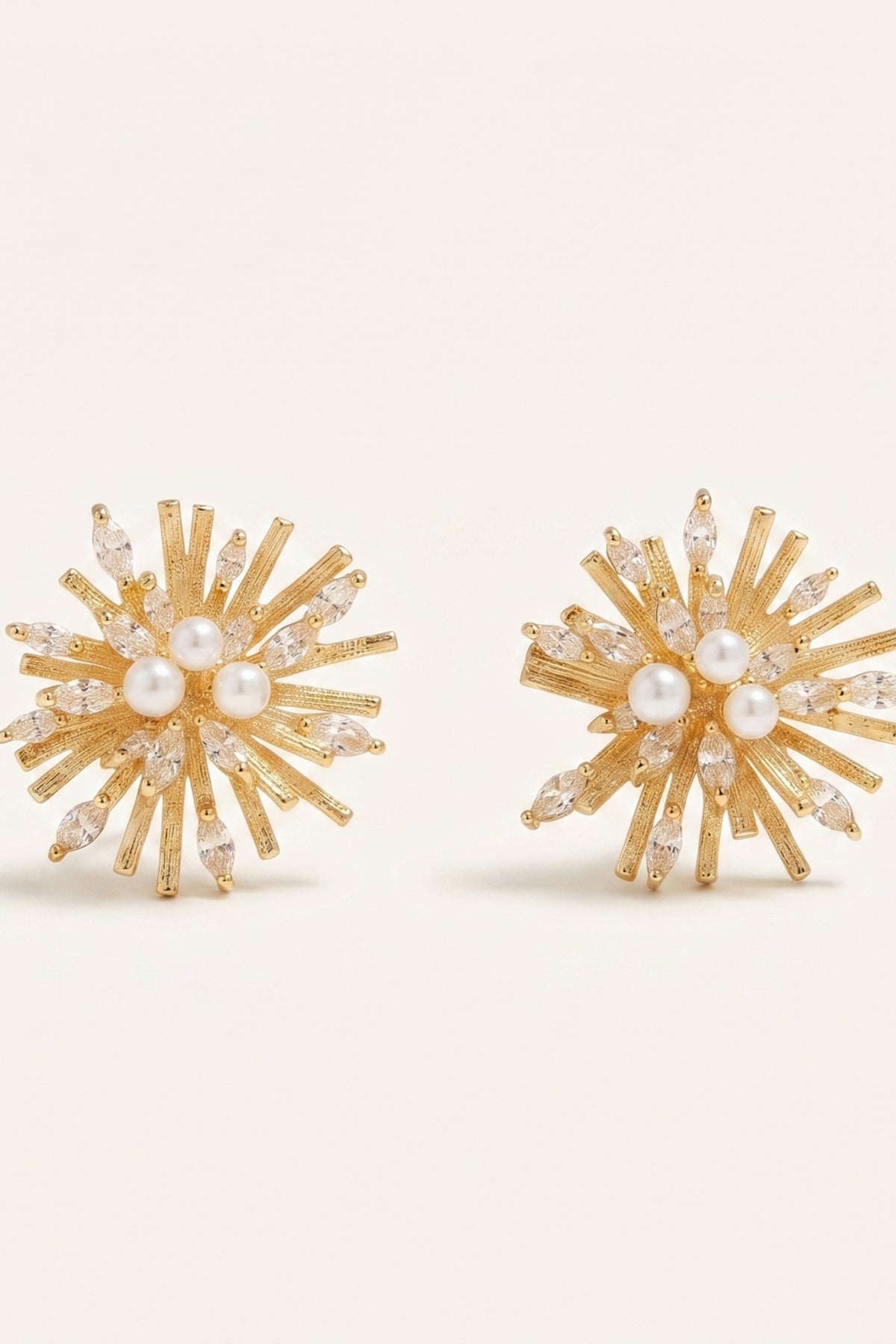 Sunburst Earrings on a cream background