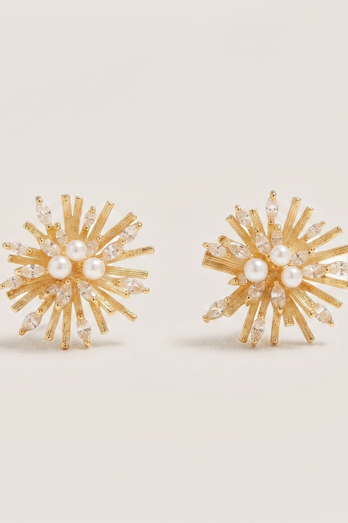 Sunburst Earrings on a cream background