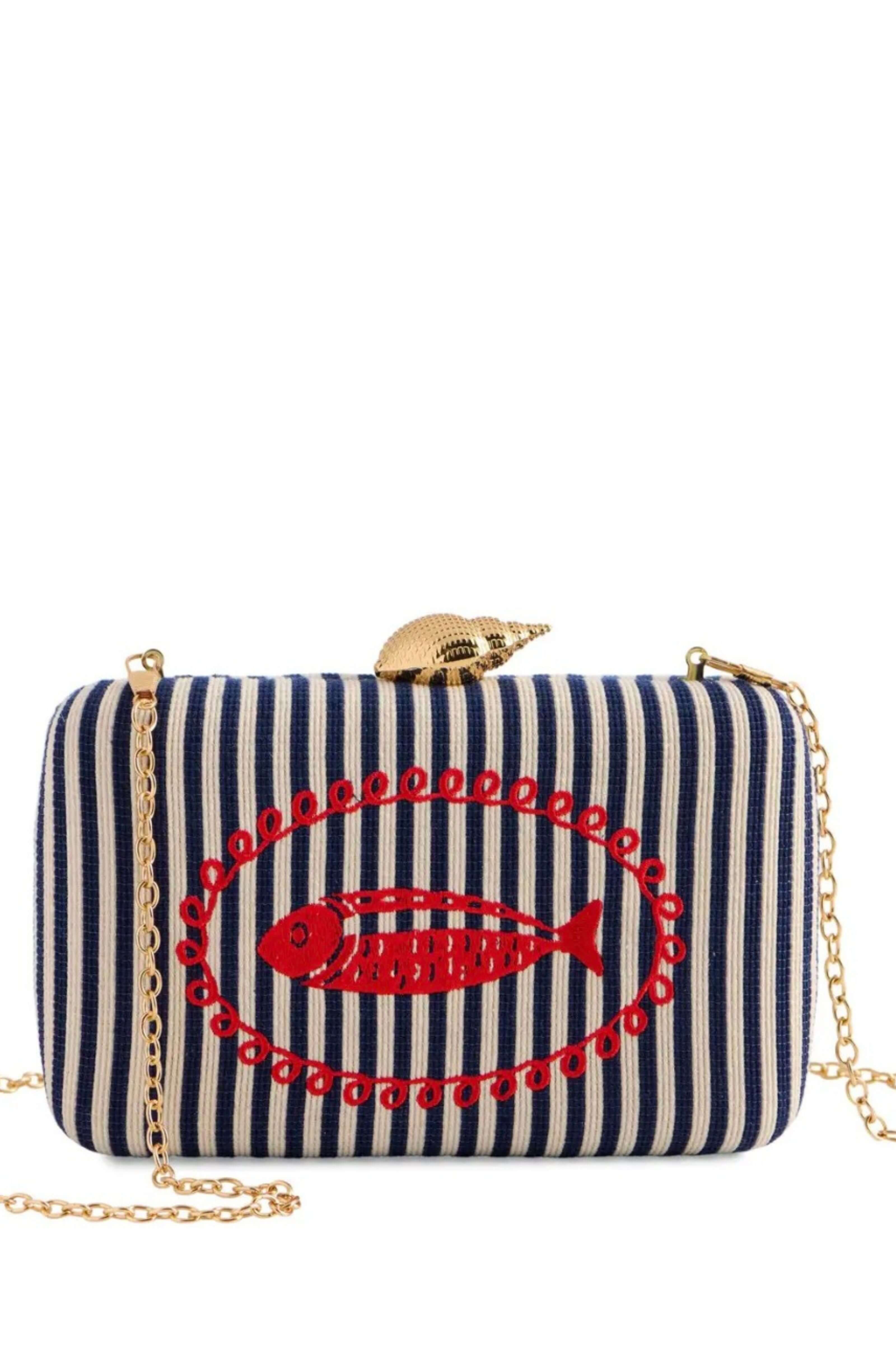 A navy and cream striped clutch bag with a red embroidered fish design and a gold chain strap, shown against a plain white background.
