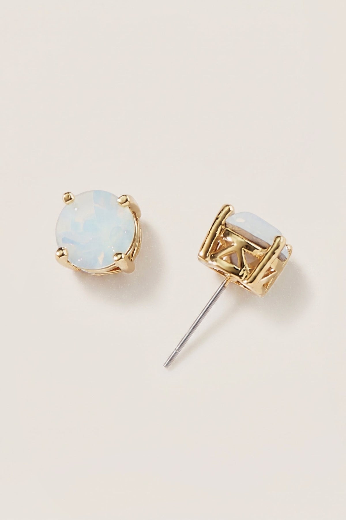 Opal Glow Statement Stud Earrings on a cream background