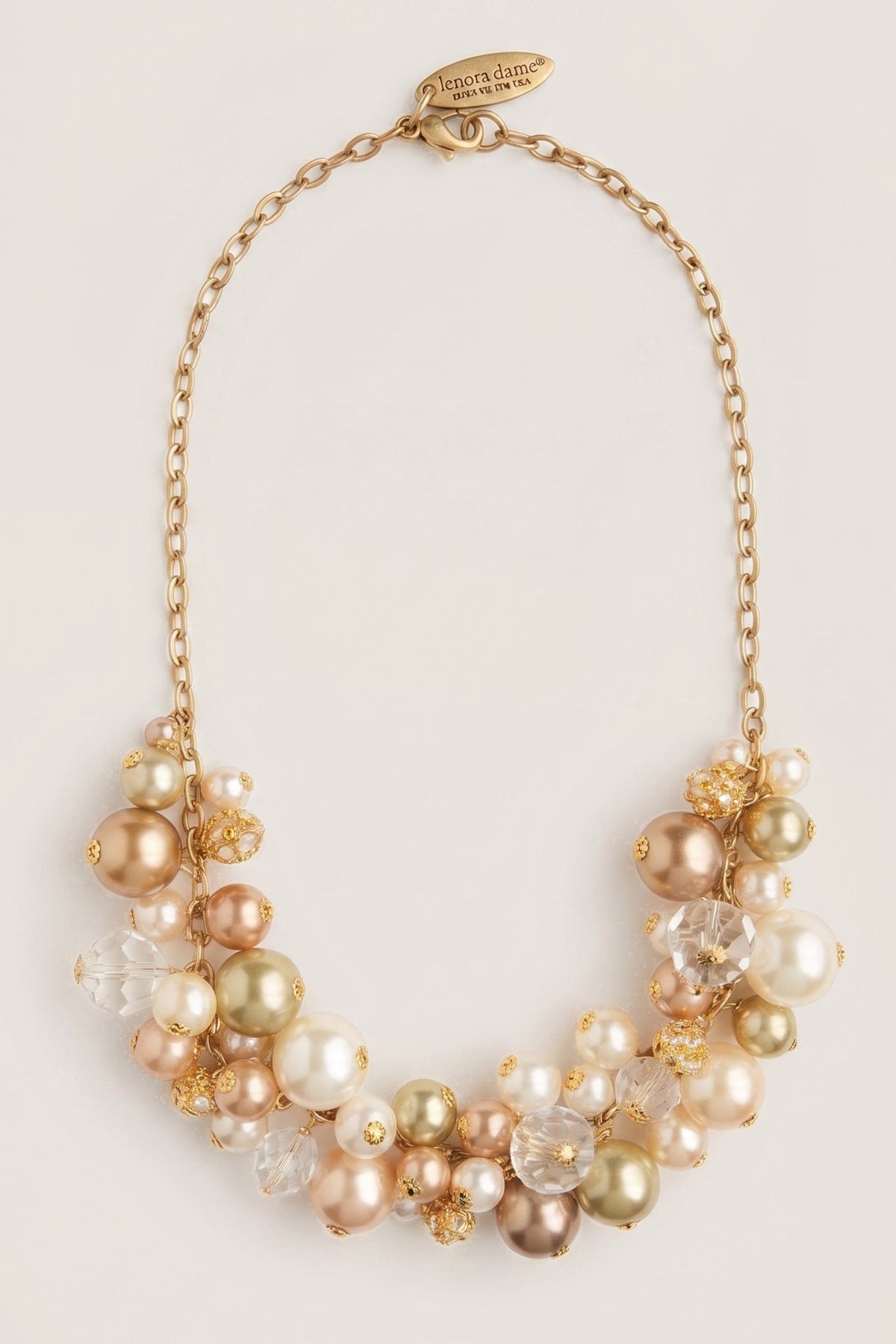 Pearl Charm Necklace on a cream background