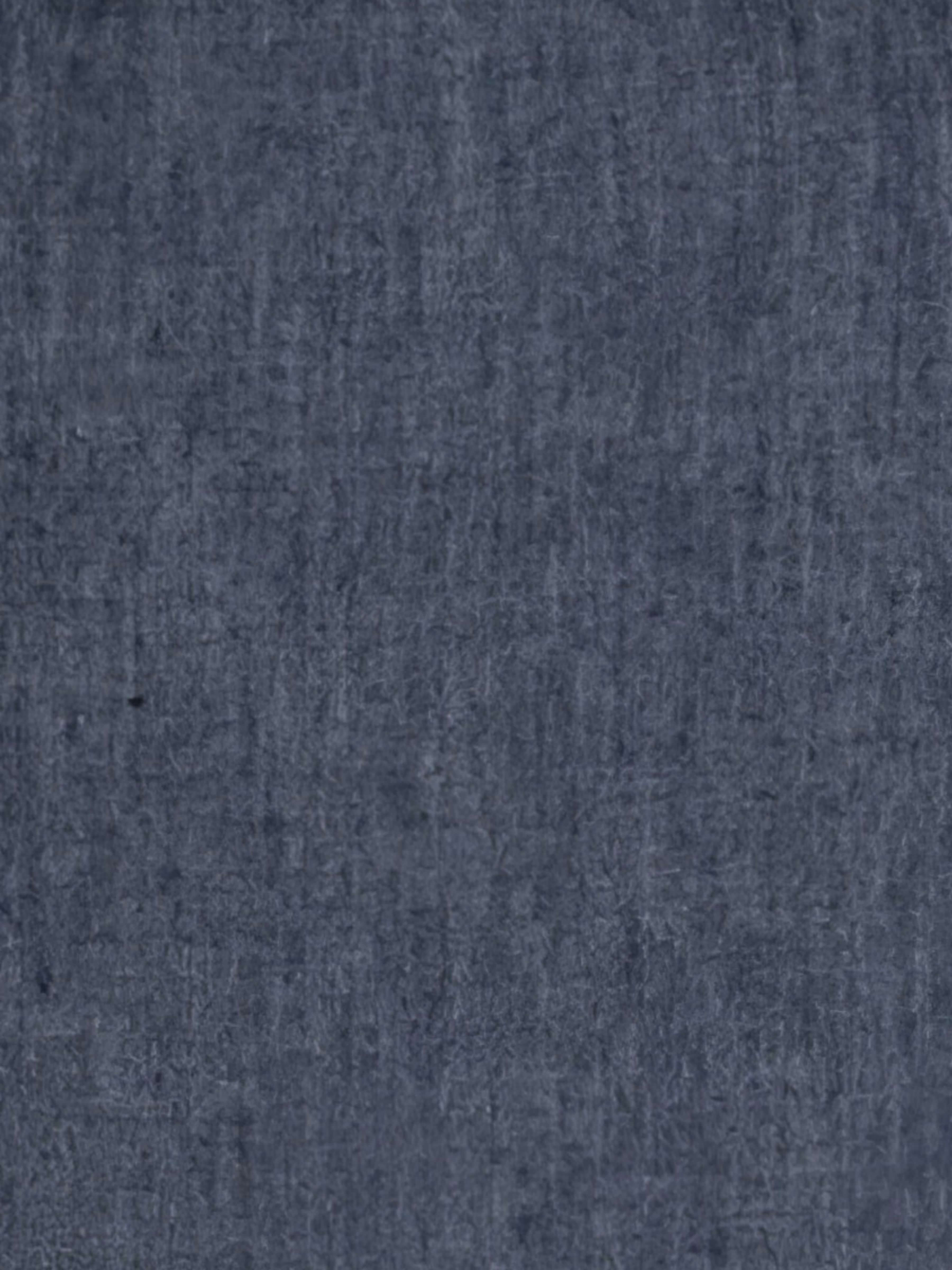 A close-up of a textured fabric in a muted slate blue color.