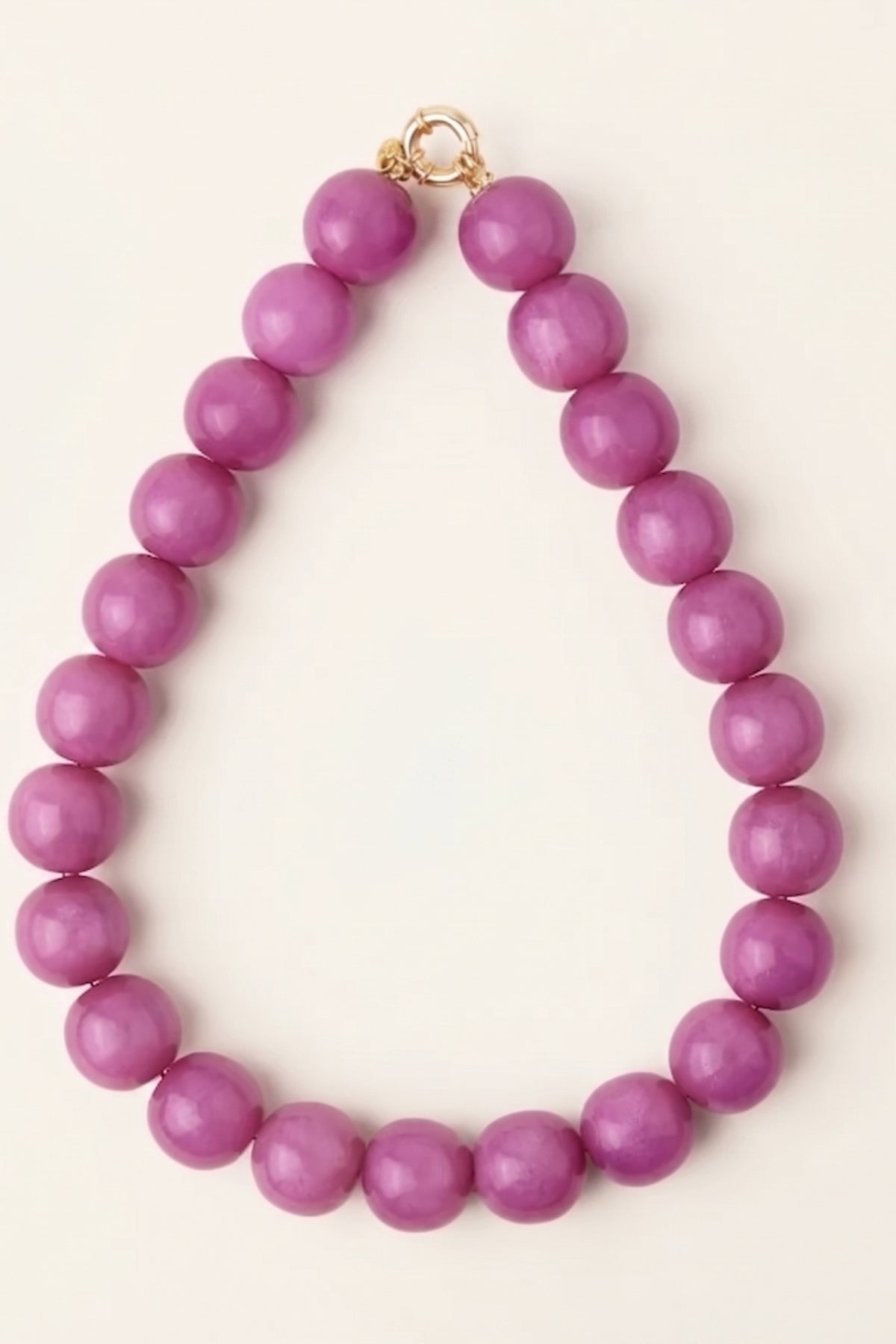 Purple Iris Large Resin Bead Necklace on a cream background