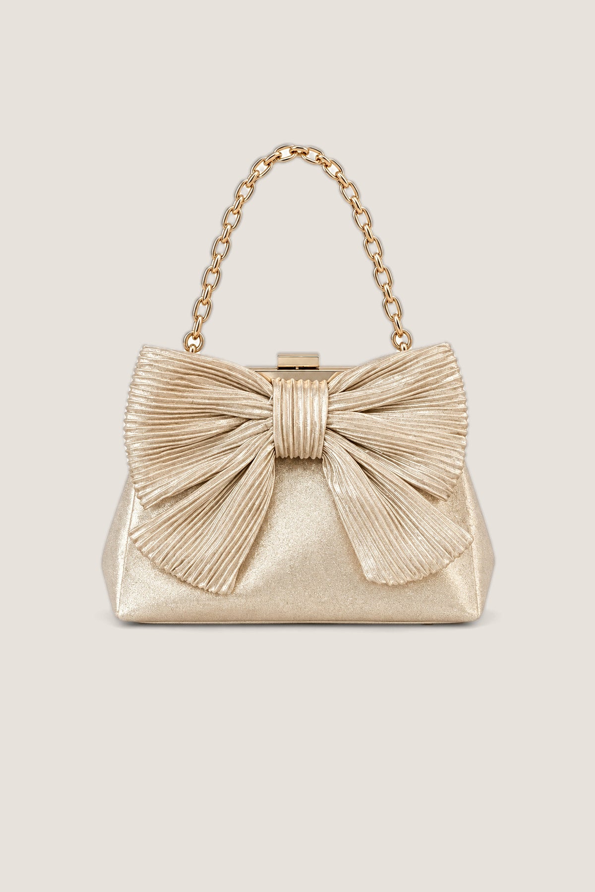 The Lisi Lerch Samantha Bag in metallic gold with a pleated bow and a gold chain handle, shown front on.