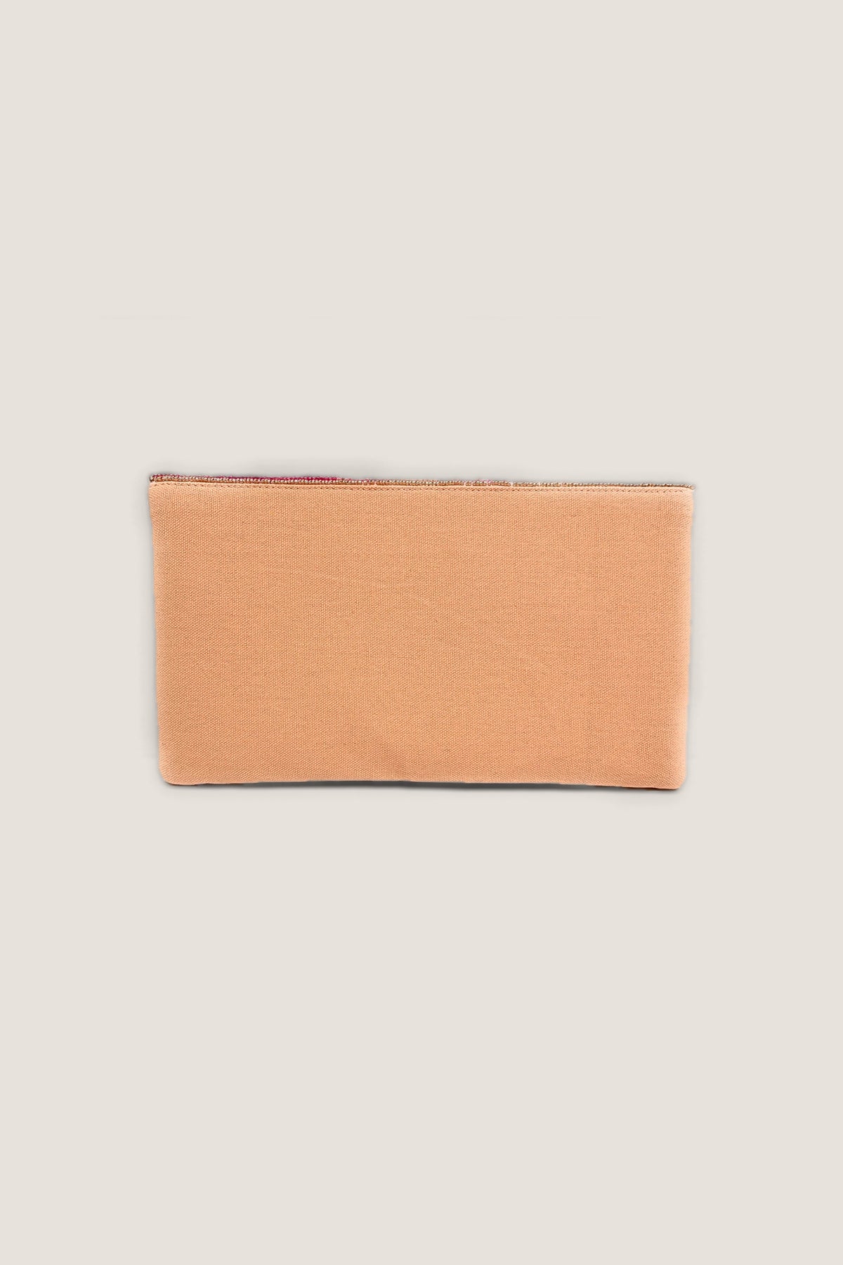 The back of the Rosé All Day Beaded Clutch in plain peach fabric.