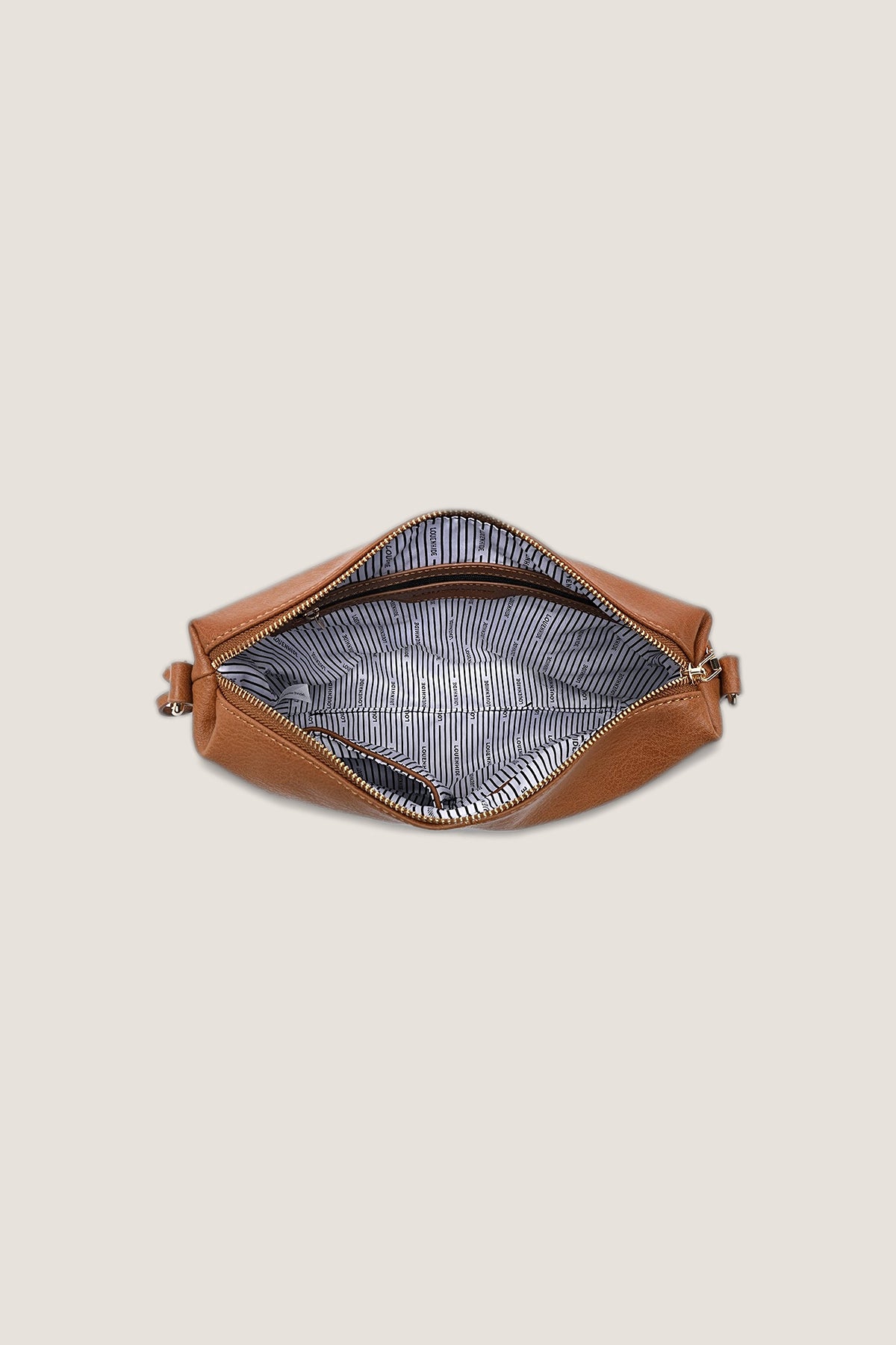 The Daisy Stripe Tan Crossbody Bag unzipped from above, showing the striped lining.