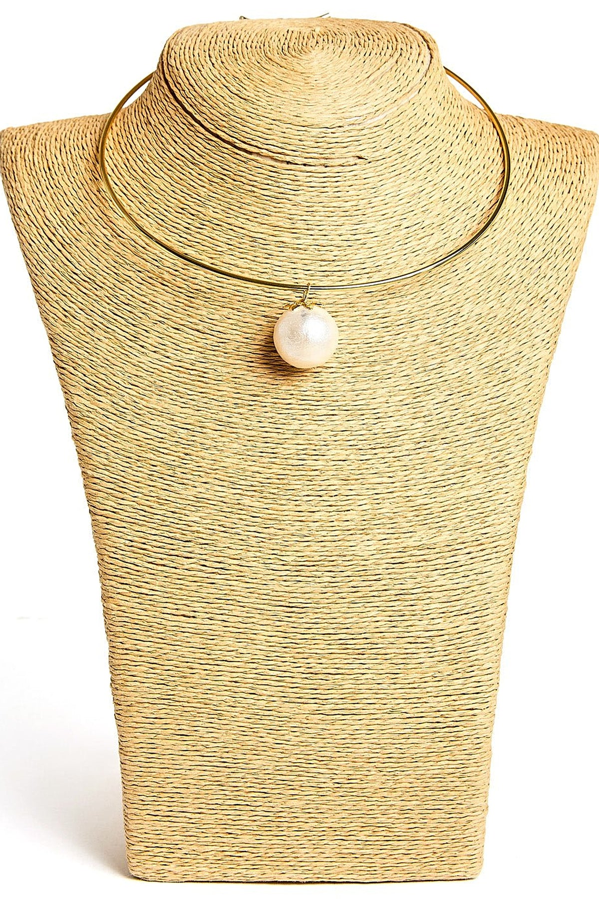Gold Birdie Cotton Pearl Collar Necklace styled on a raffia bust, showing the rigid collar and the cotton pearl pendant.