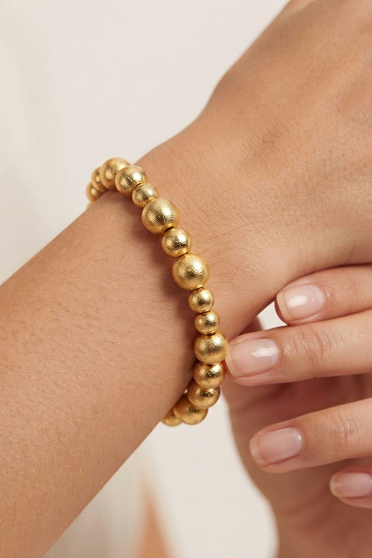 Georgia Gold Beaded Bracelet worn on the wrist, showing the size of the mixed 10mm and 8mm gold beads.