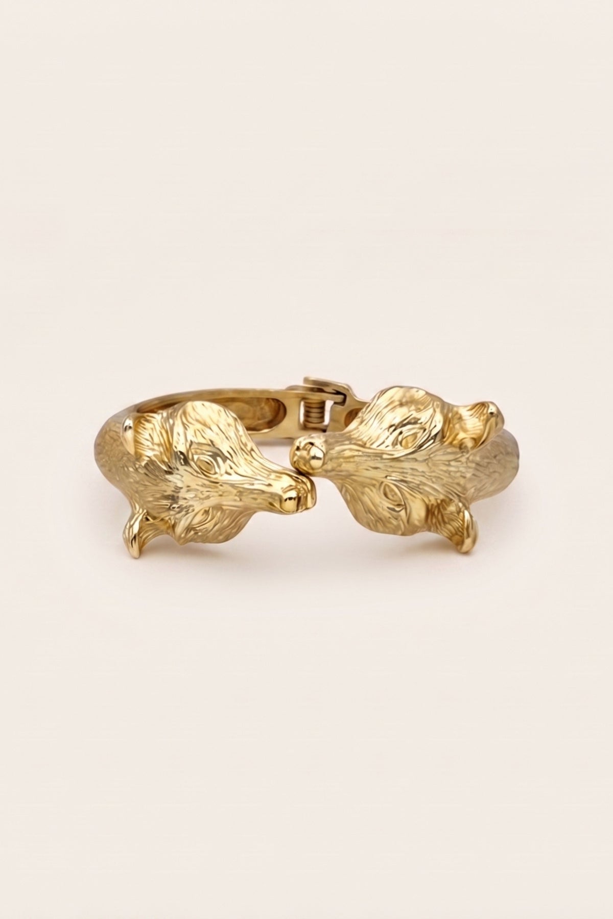 Gold Bracelet with two fox heads meeting in the center. 