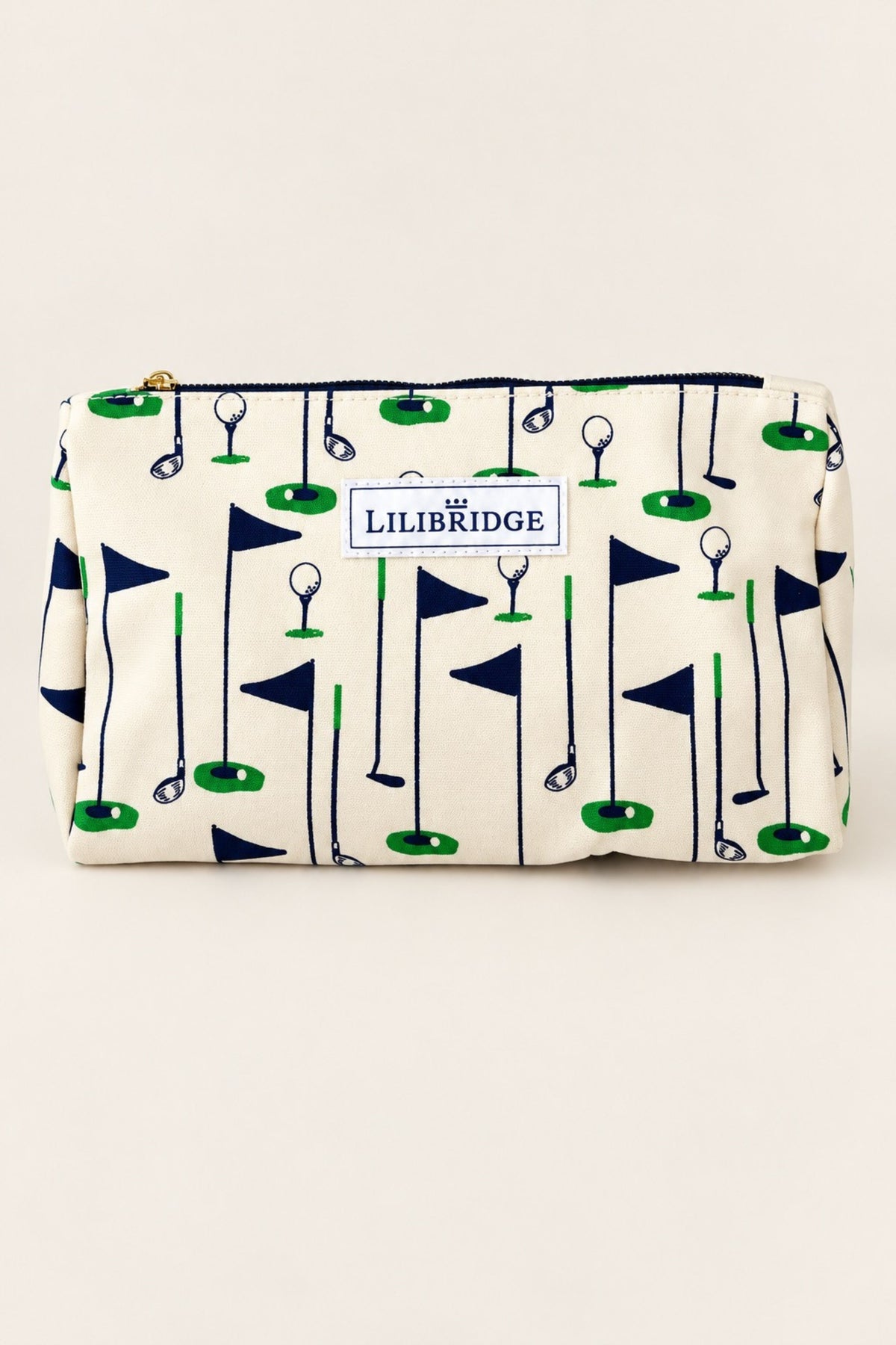 A rectangular zip pouch with an off-white background and a golf flag pattern in navy blue and green. A white label on the front reads 'LILIBRIDGE'.