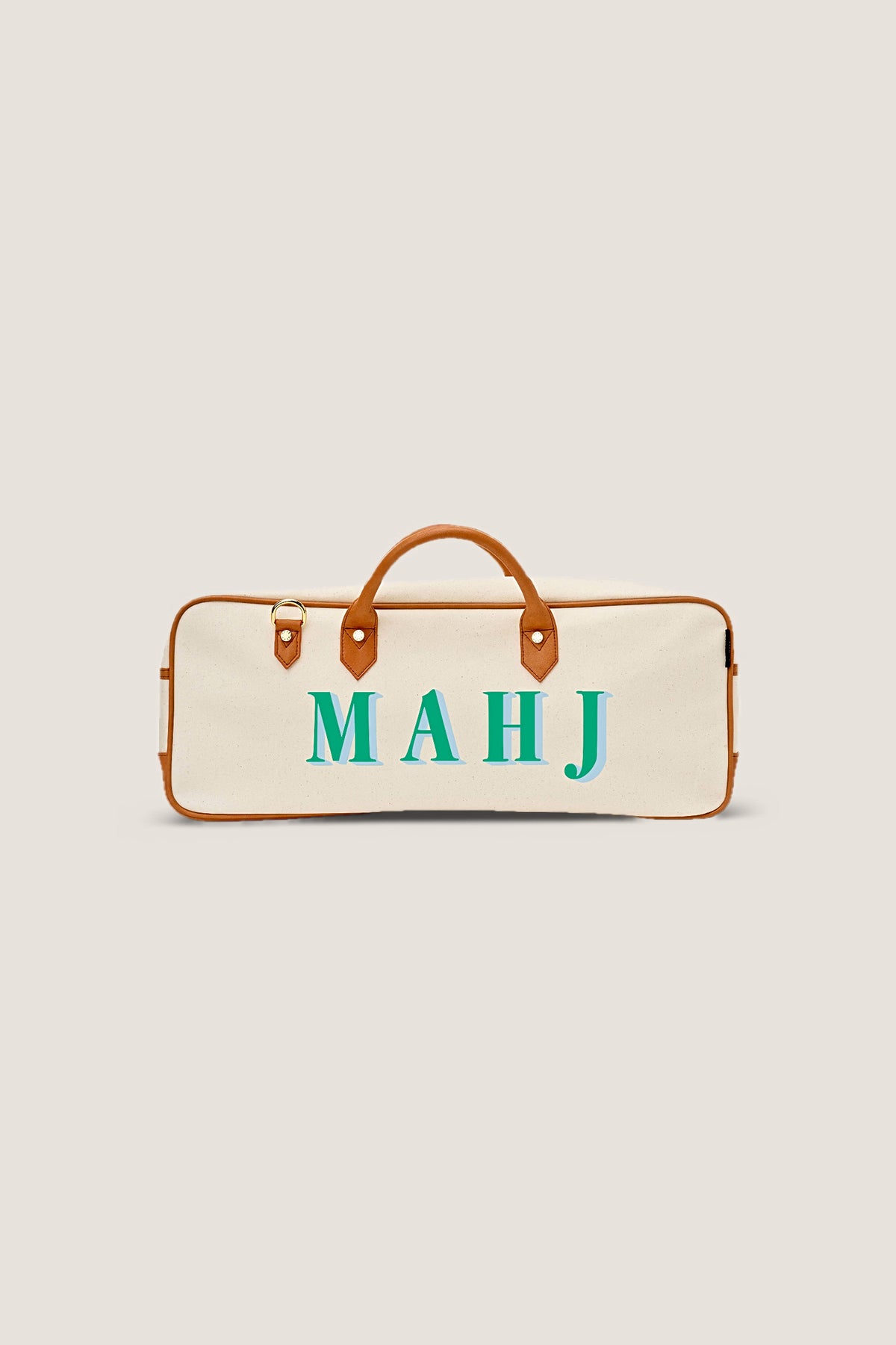 The Mint Margo mahjong tote in natural canvas with cognac trim and mint and sky MAHJ lettering, front view.