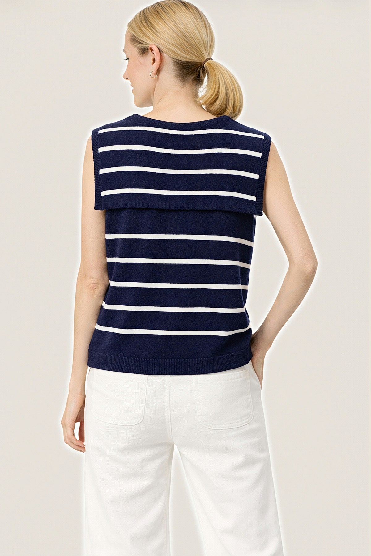 Back view of the navy and white striped sleeveless sailor sweater with a sailor collar.