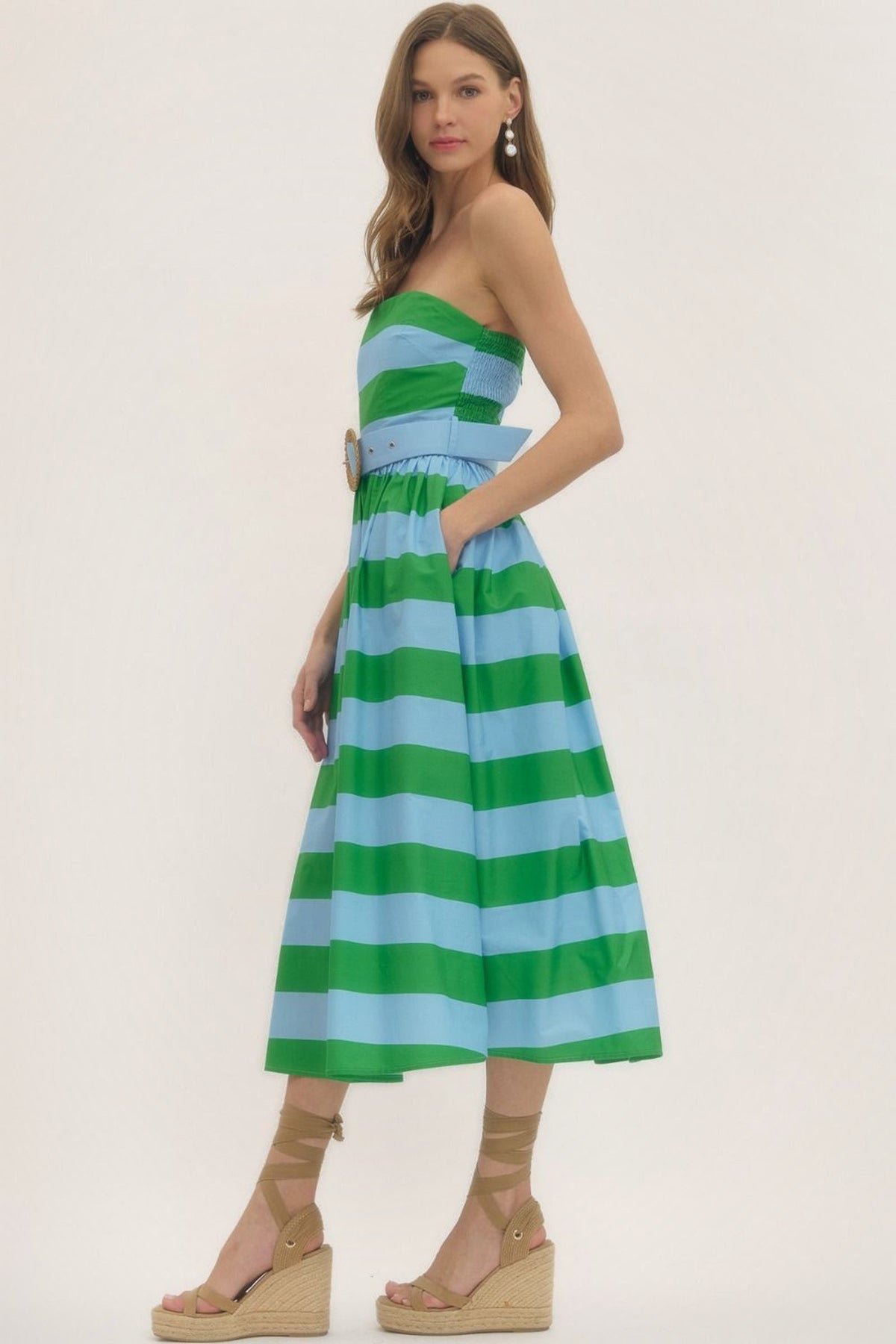 Front view of the green and blue striped strapless midi dress with a woven buckle belt.
