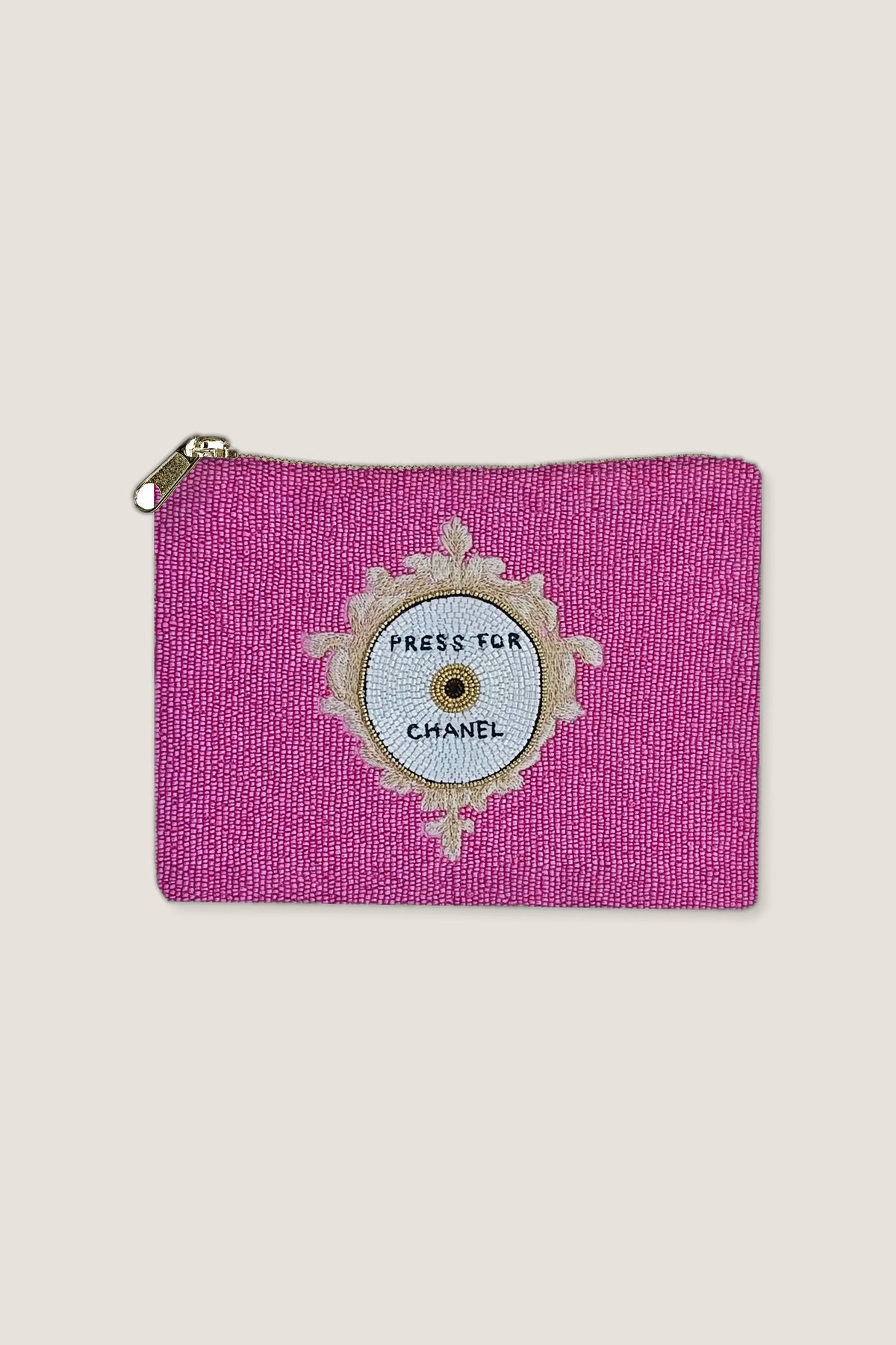 Fully beaded hot pink pouch with a round 'Press for Chanel' button design on the front.