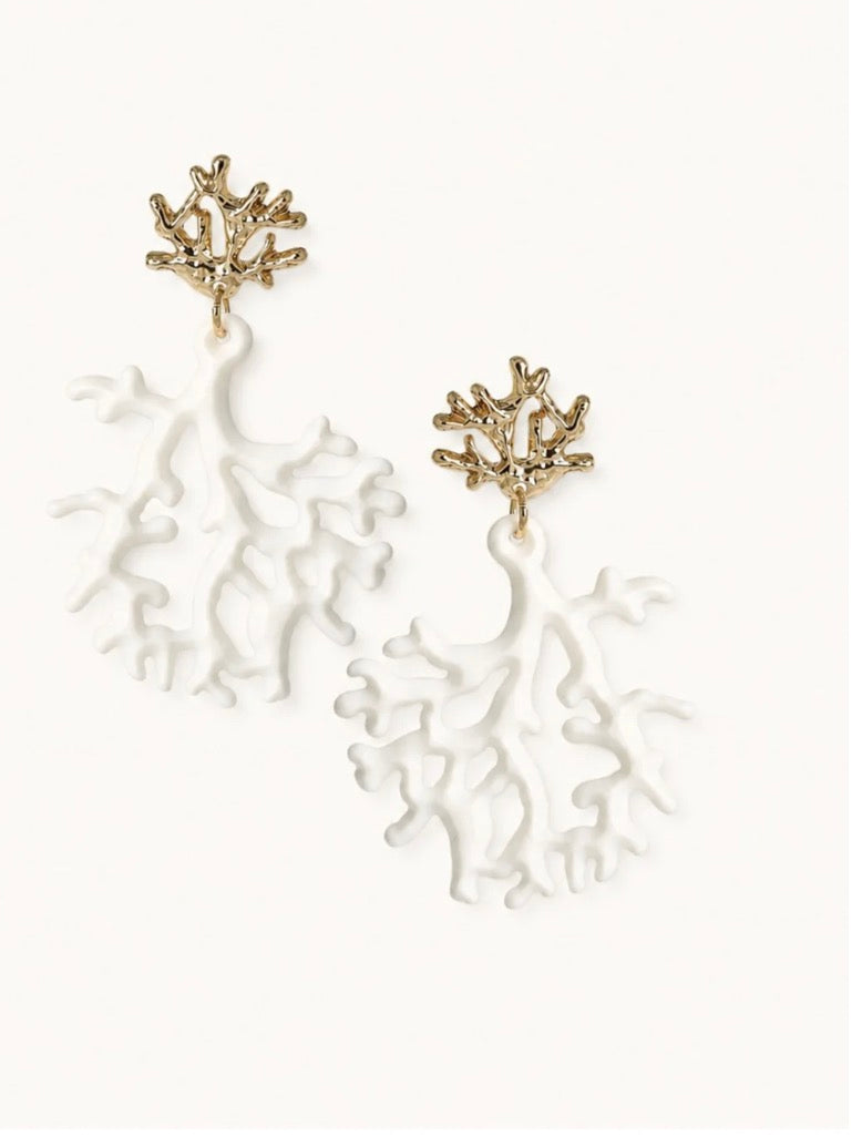 A pair of dangling earrings with textured gold branching tops and white branching drop charms, displayed on a clean off-white background.