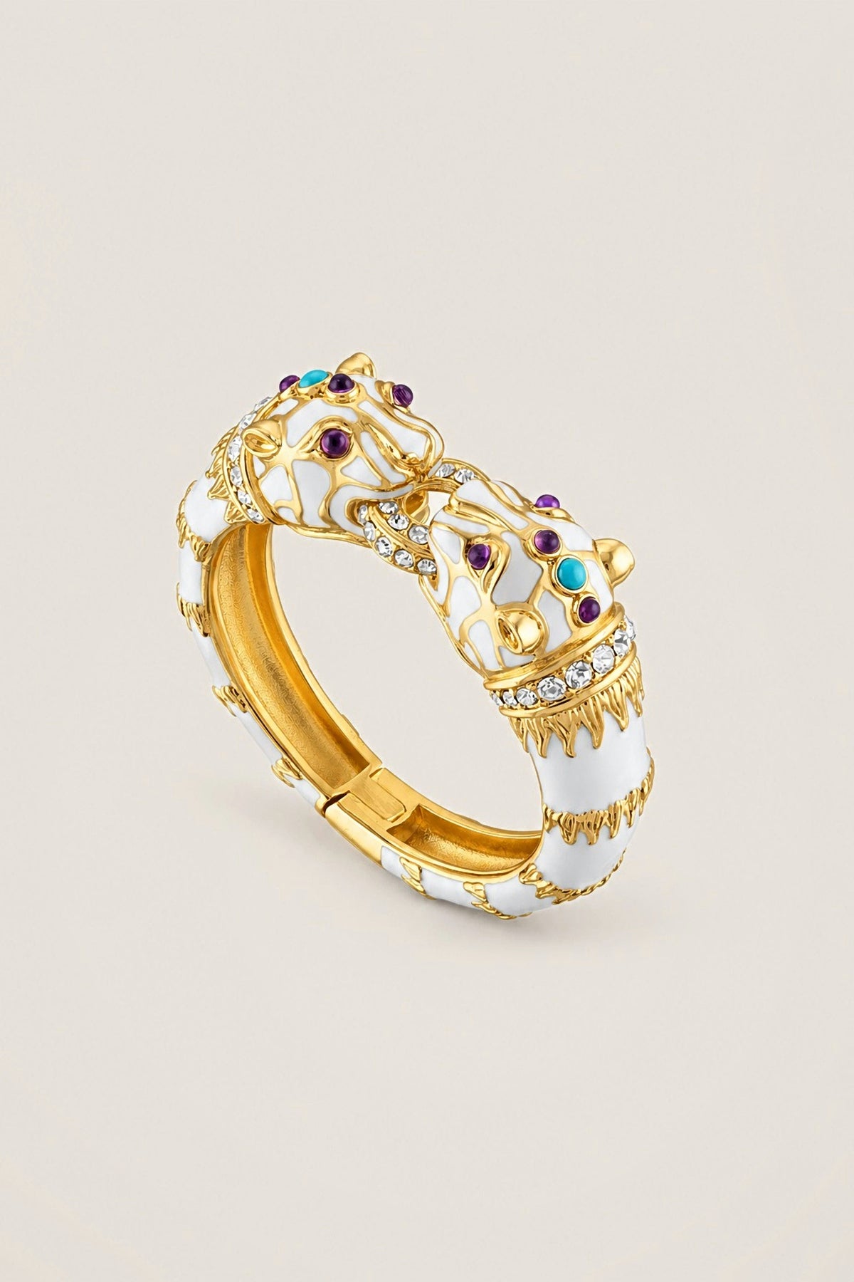 White Enamel Double Panther Bracelet in 18K gold plate over brass with white enamel, crystals, amethyst and turquoise cabochons, on a warm greige backdrop.