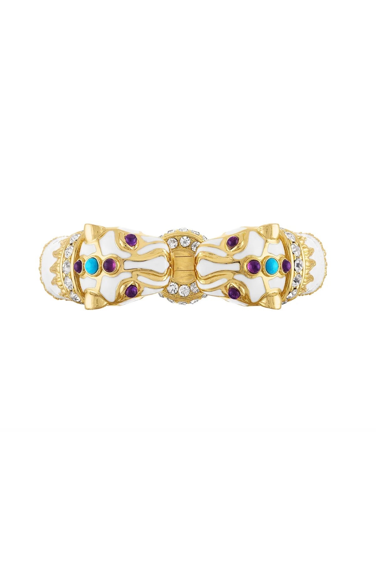 A gold and white enamel bow-shaped brooch decorated with small purple and turquoise gemstones and clear crystal accents, set against a plain white background.