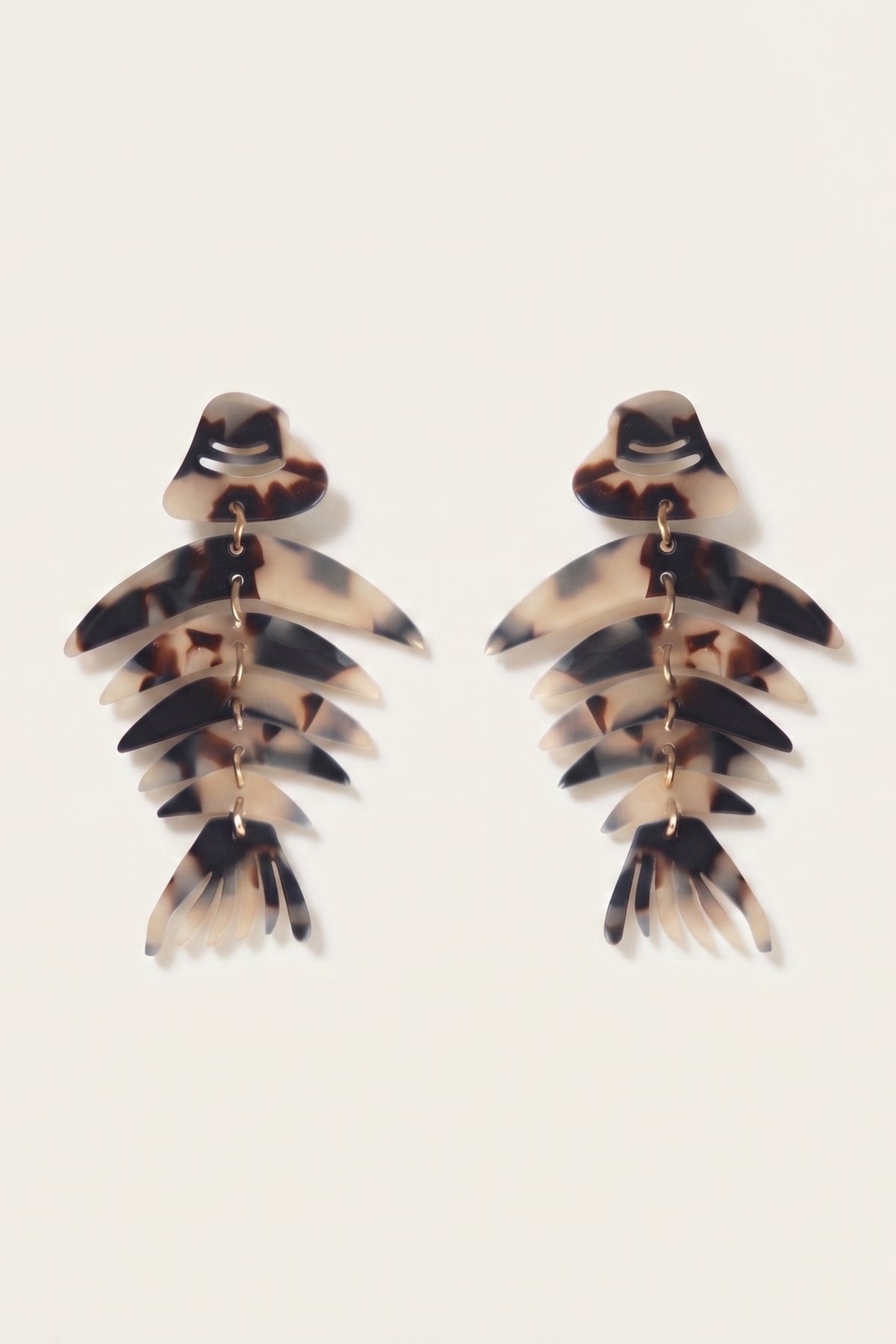 Bonefish Monstera Acrylic Drop Earrings on a cream background