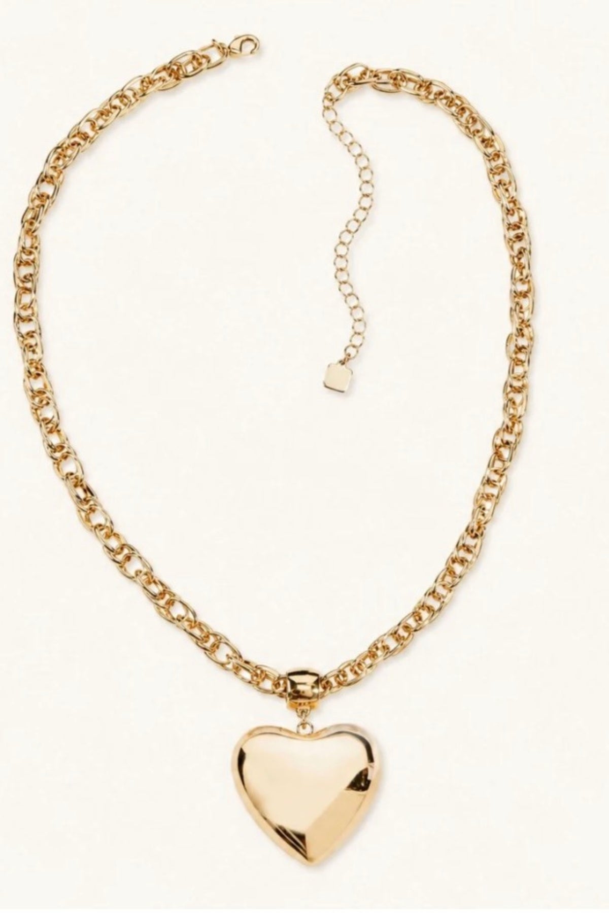 Golden Heart Chain Necklace on a cream background