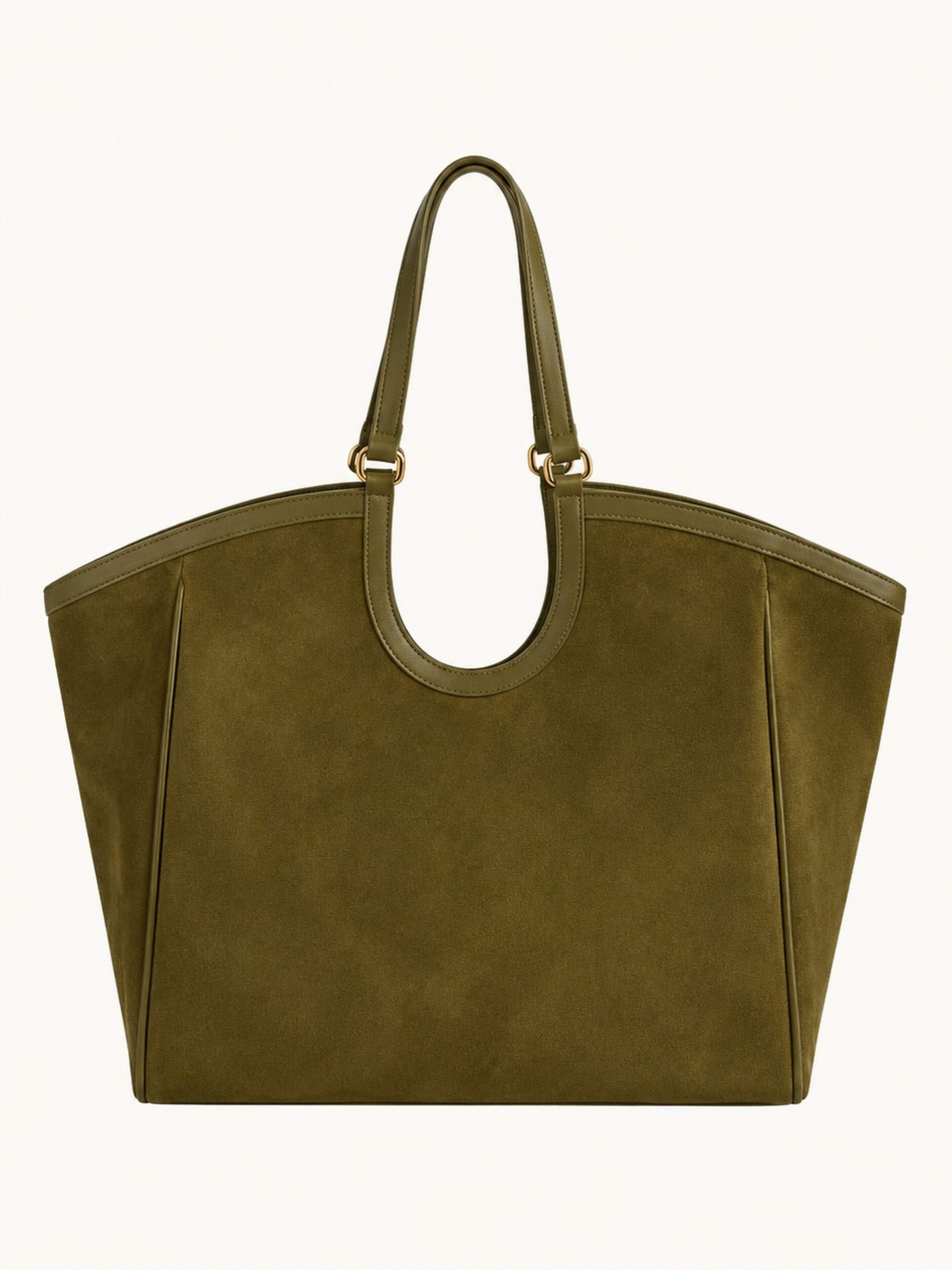 An olive green suede tote bag with double top handles and gold-tone hardware, shown against a plain off-white background.